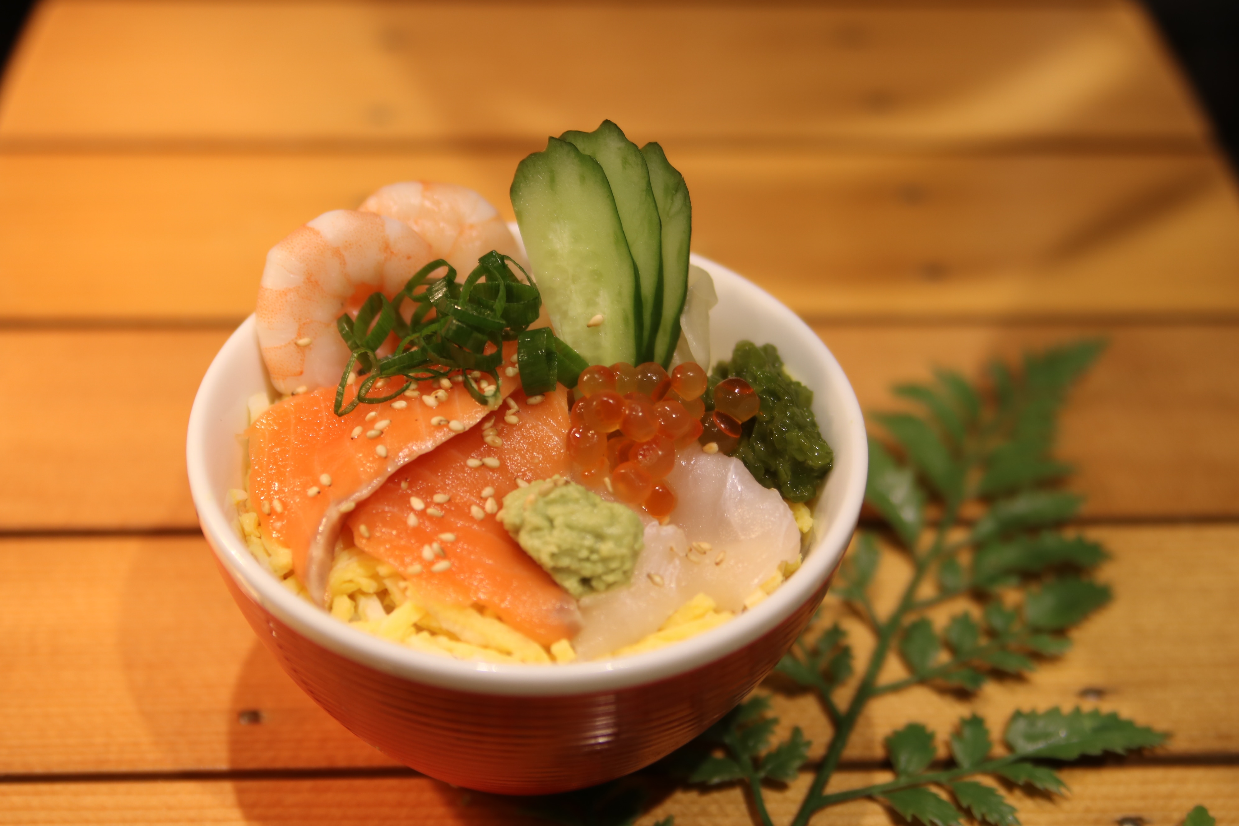 Bowl of rice topped with sashimi