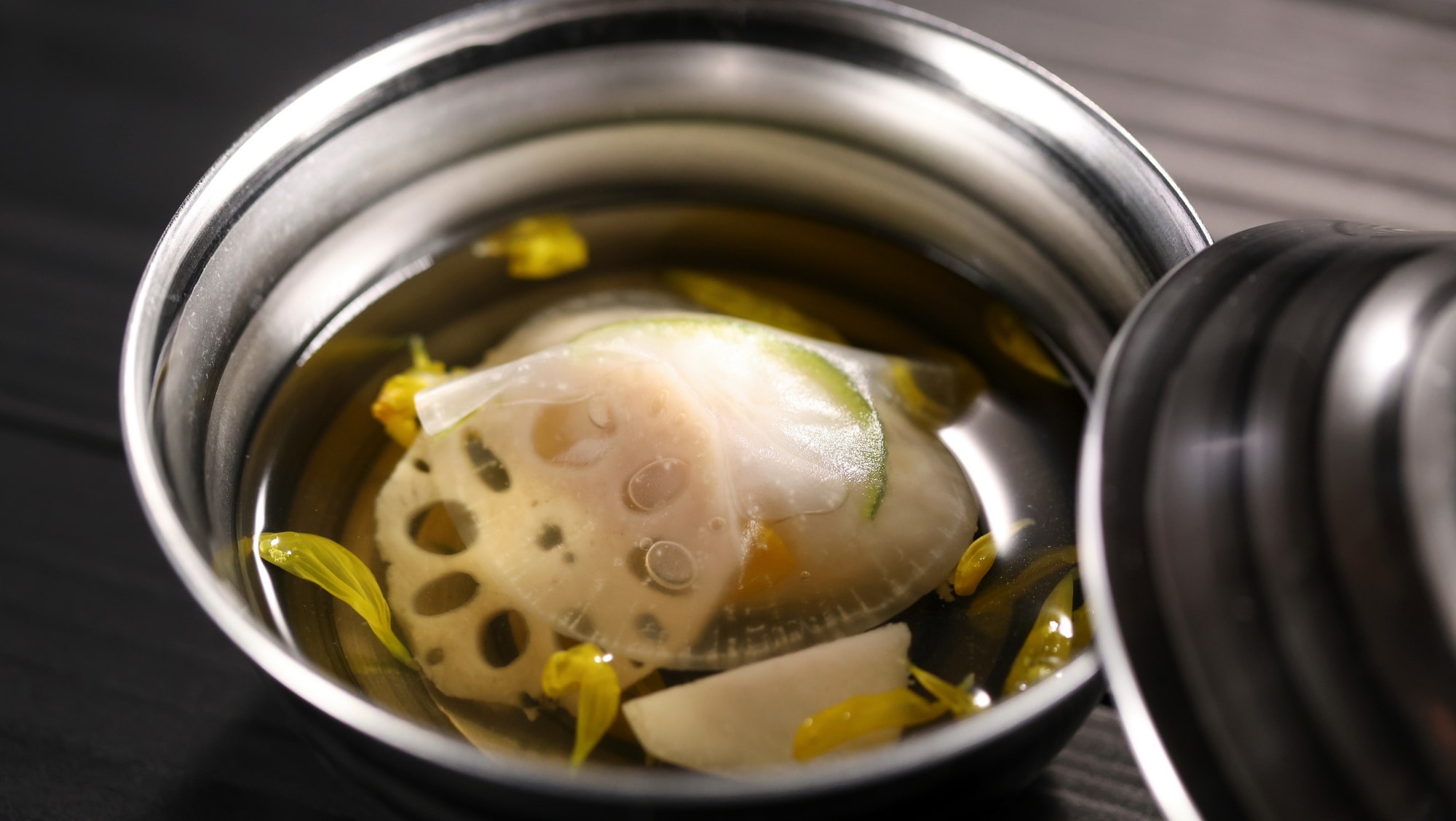 [Autumn 2026] First course: Greenling fish paste in a clear broth, garnished with chrysanthemum petals, a dish truly representative of autumn.
