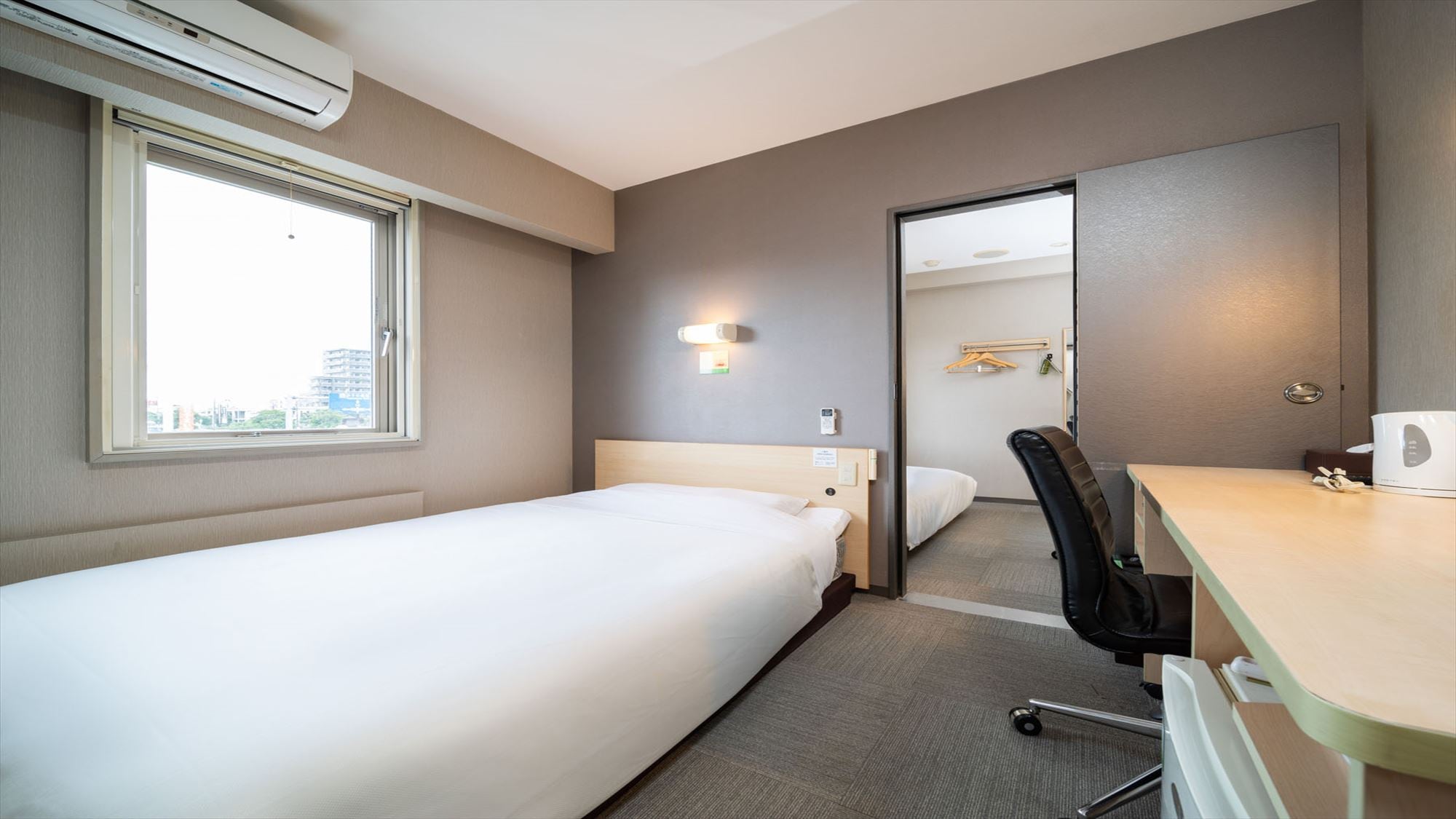 This room has two rooms with a door between them.