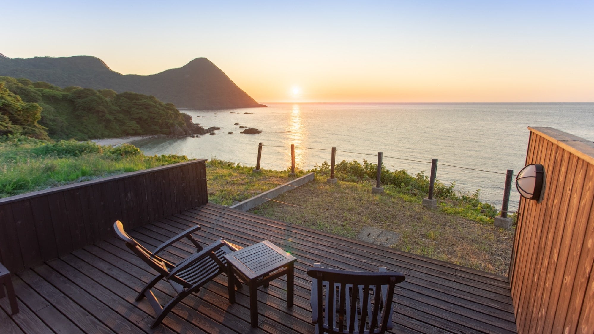 A luxurious moment overlooking the sunset-colored sea