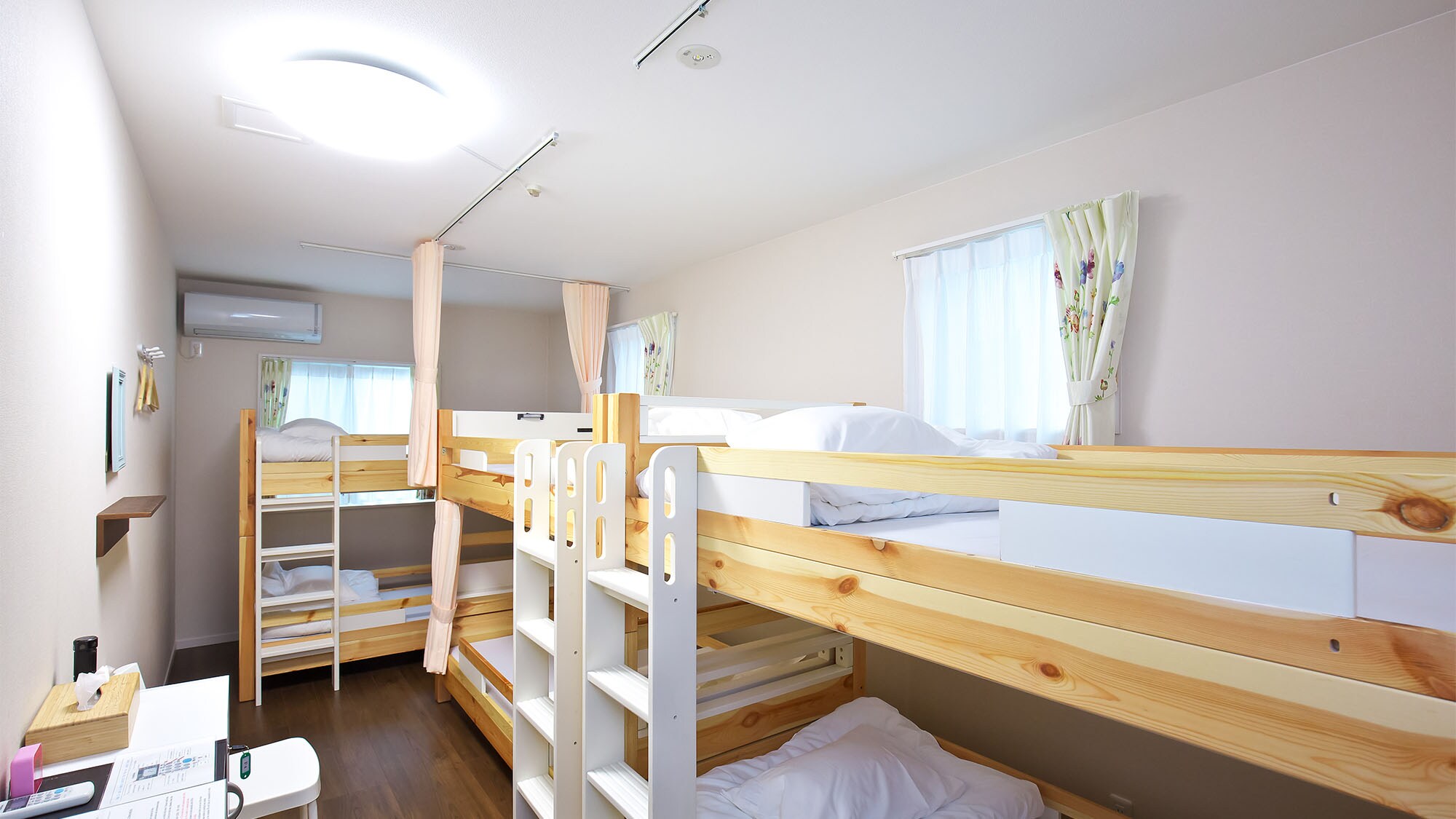 ・ <Women-only dormitory> Guest room with wooden bunk beds. Usually it will be a shared room