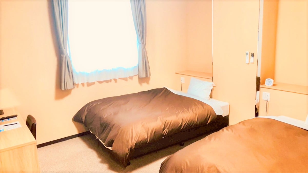 New twin room with two 140cm double beds.