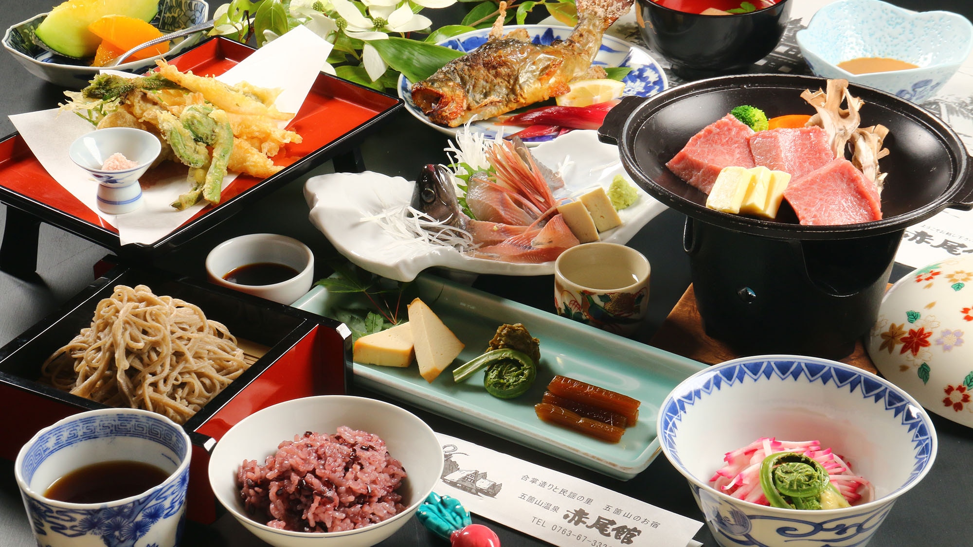 Local cuisine made with ingredients from Gokayama, such as Himi beef grilled on a ceramic plate, rock fish grilled with salt, and handmade soba noodles.