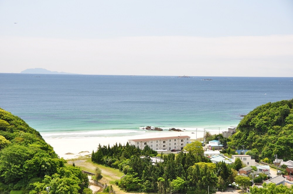 The view from the condominium grounds. The contrast between the white sand beach and the crystal clear ocean is beautiful.
