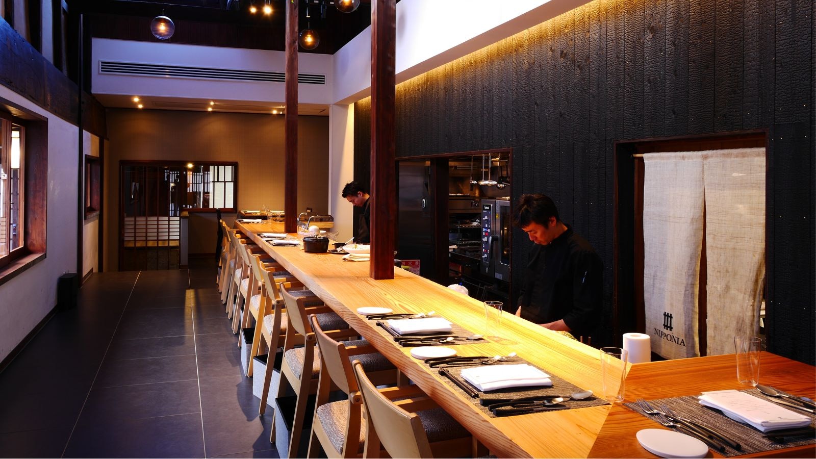 A counter dining room that has been given a modern makeover while leaving the beams and ceiling intact