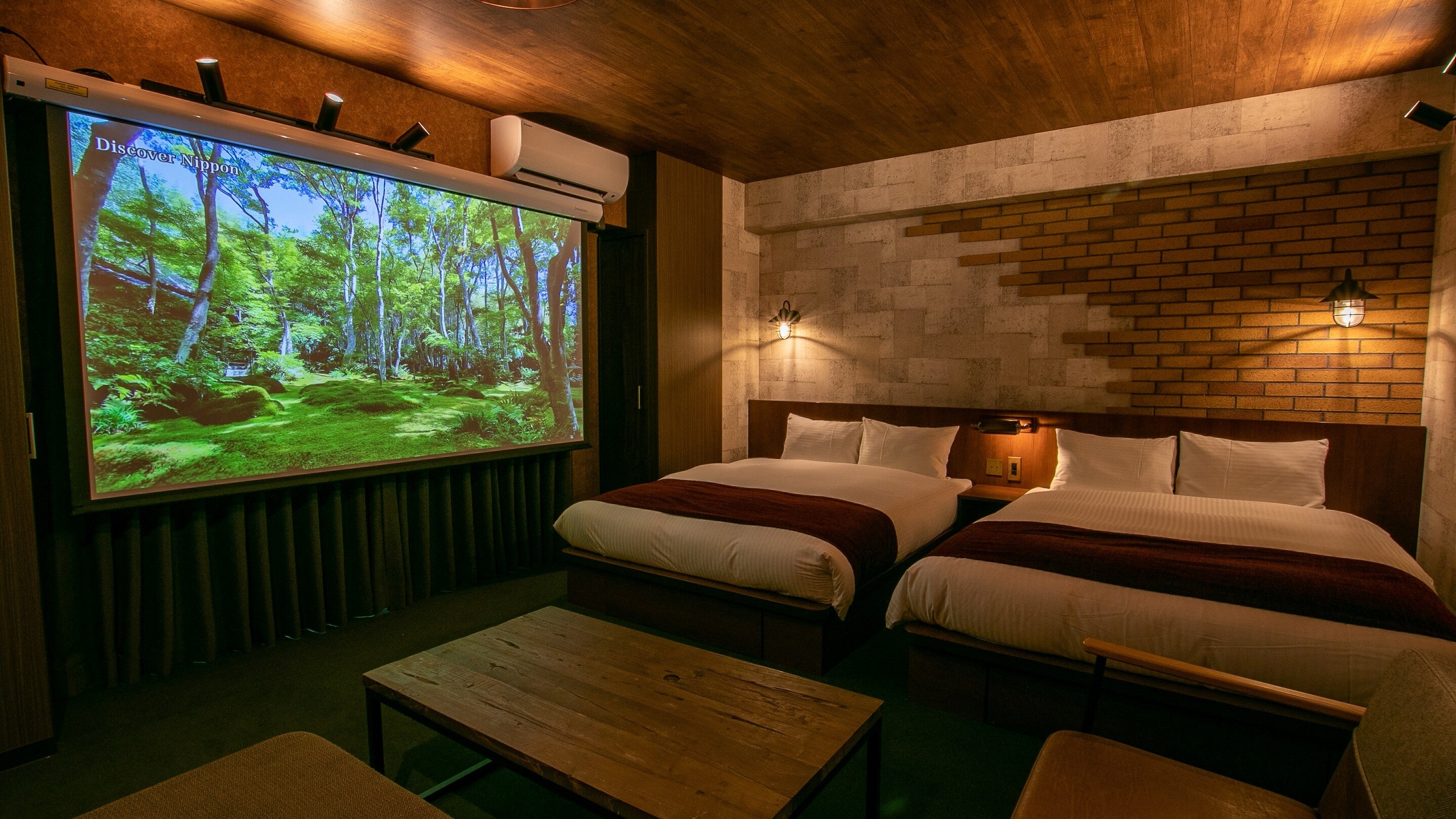 This room comes with two double beds and one sofa bed, as well as a large, impressive screen ☆ Enjoy your time here!