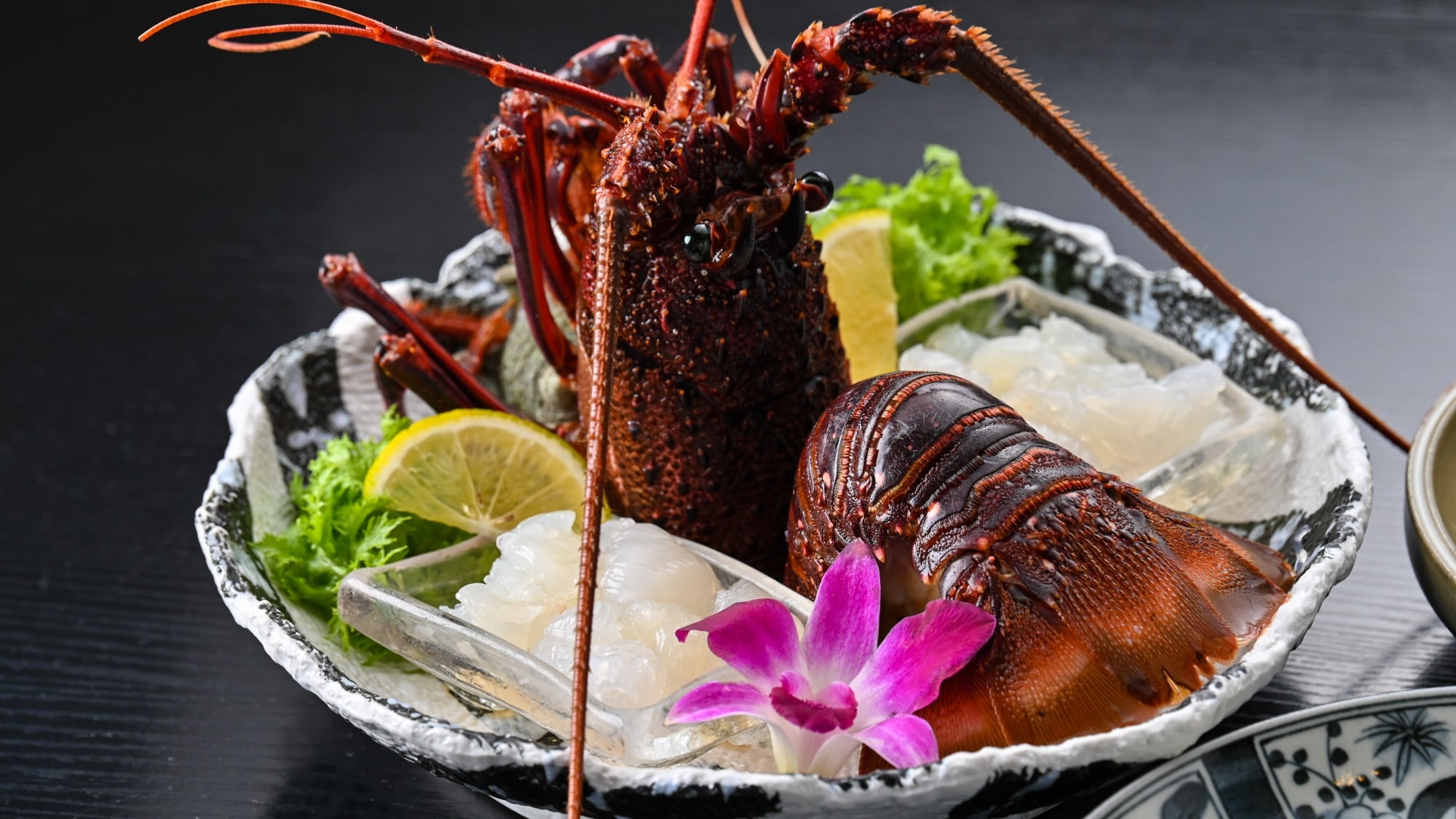 Live spiny lobster sashimi