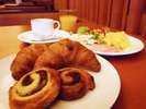 <Freshly baked bread> Freshly baked croissants and Danish pastries are available on the breakfast menu.