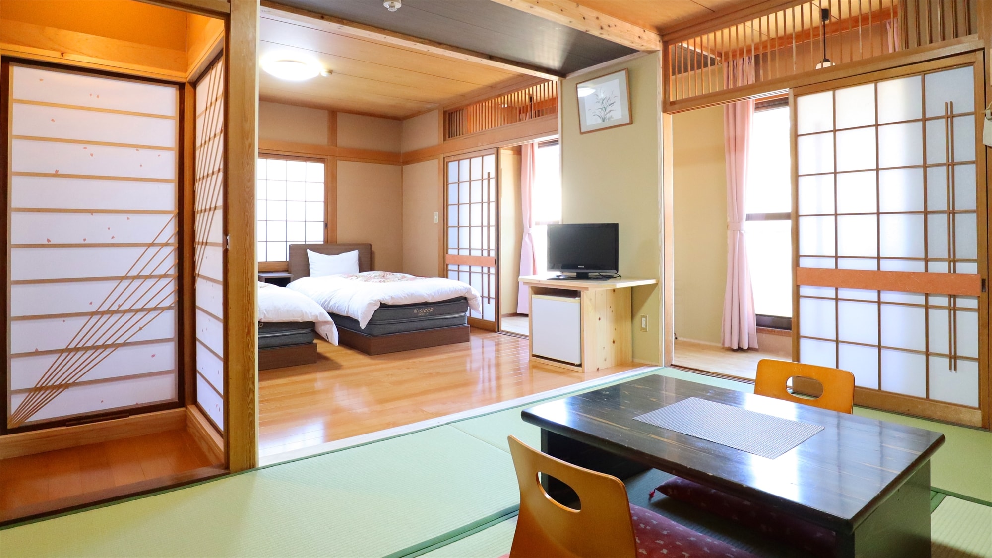 A twin-bed Western-style room and a Japanese-style room