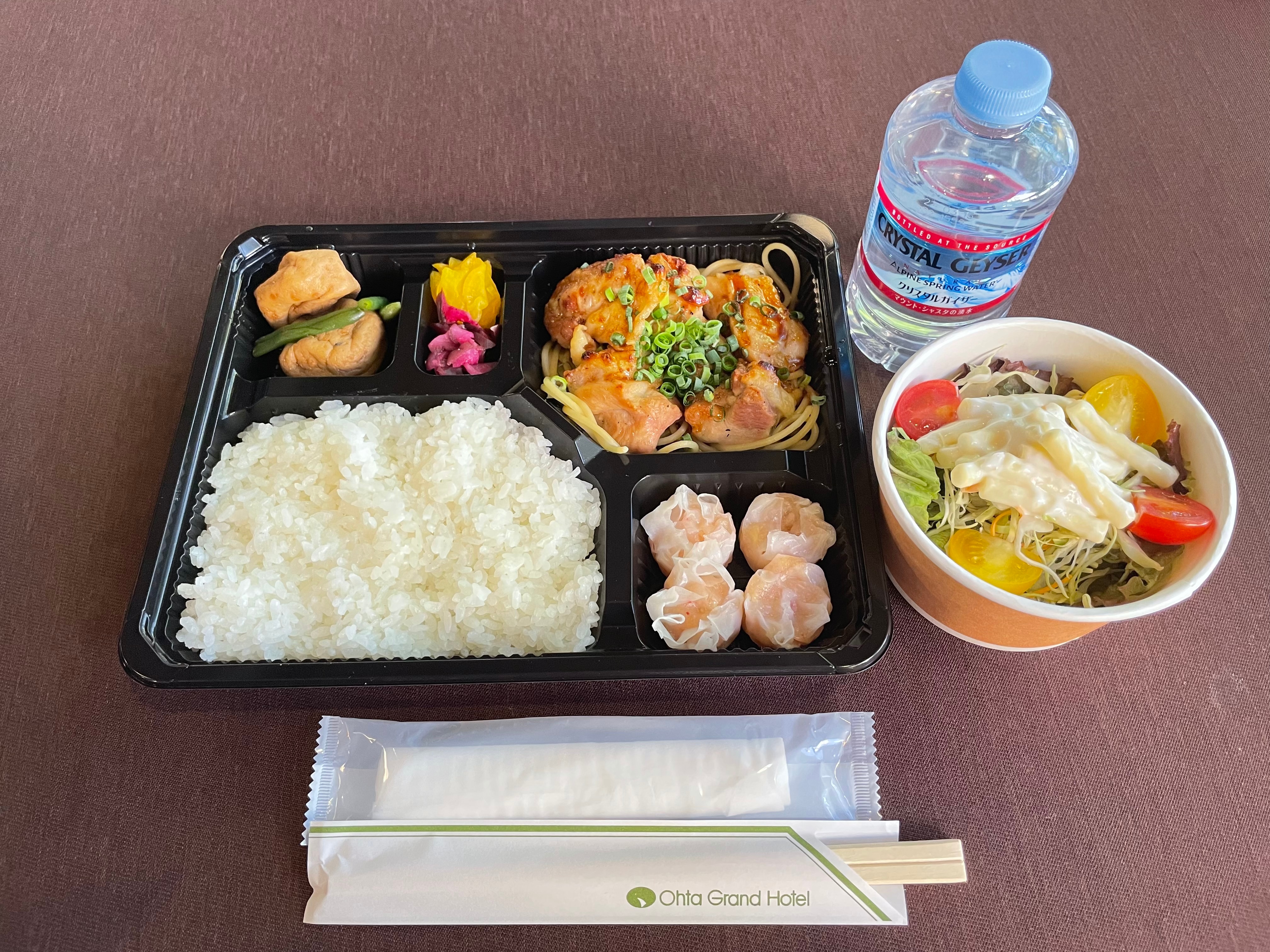 Garlic chicken bento, salad and mineral water included