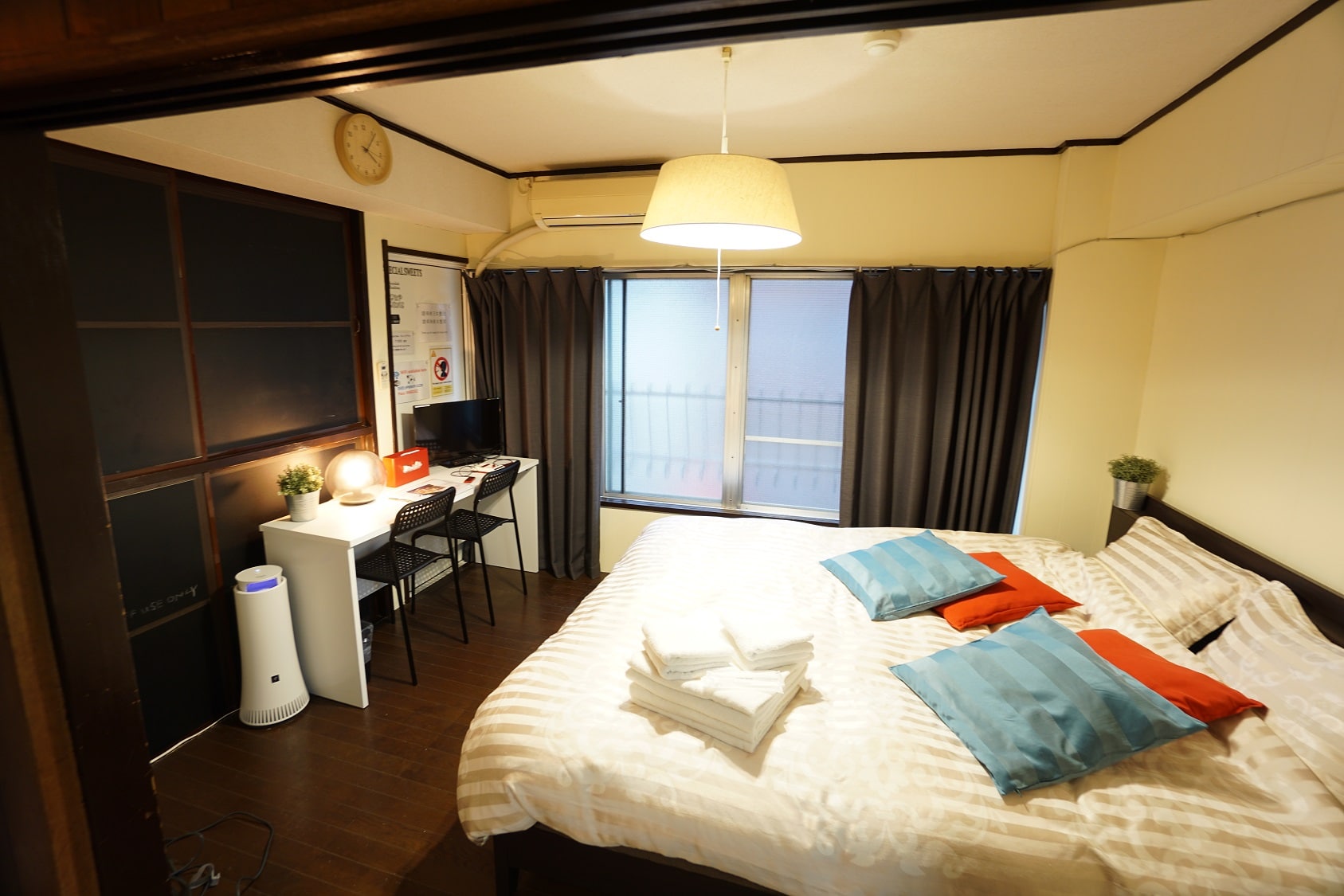 The bedroom is separated from the kitchen and dining area.
