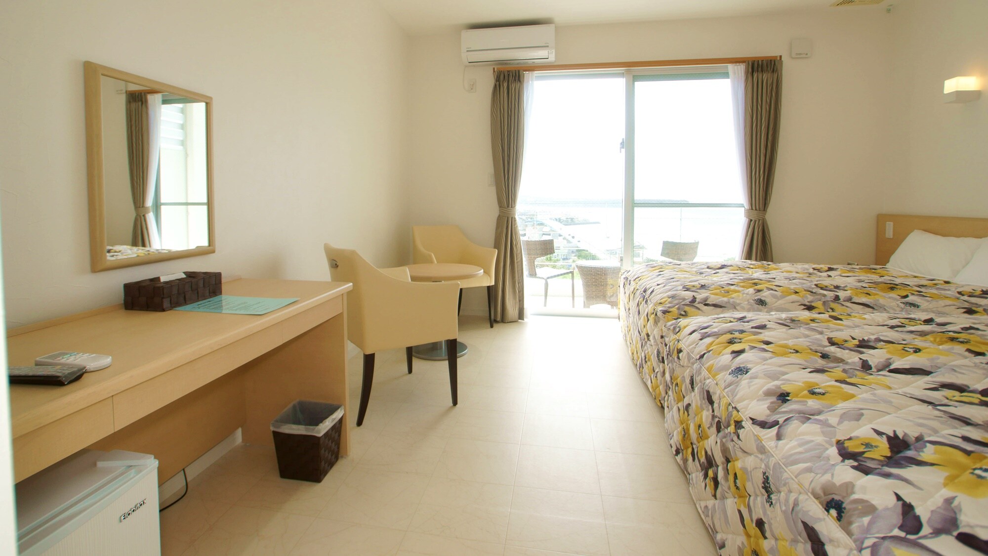 * Example of guest room / All rooms have private balconies overlooking the blue sea and the setting sun!