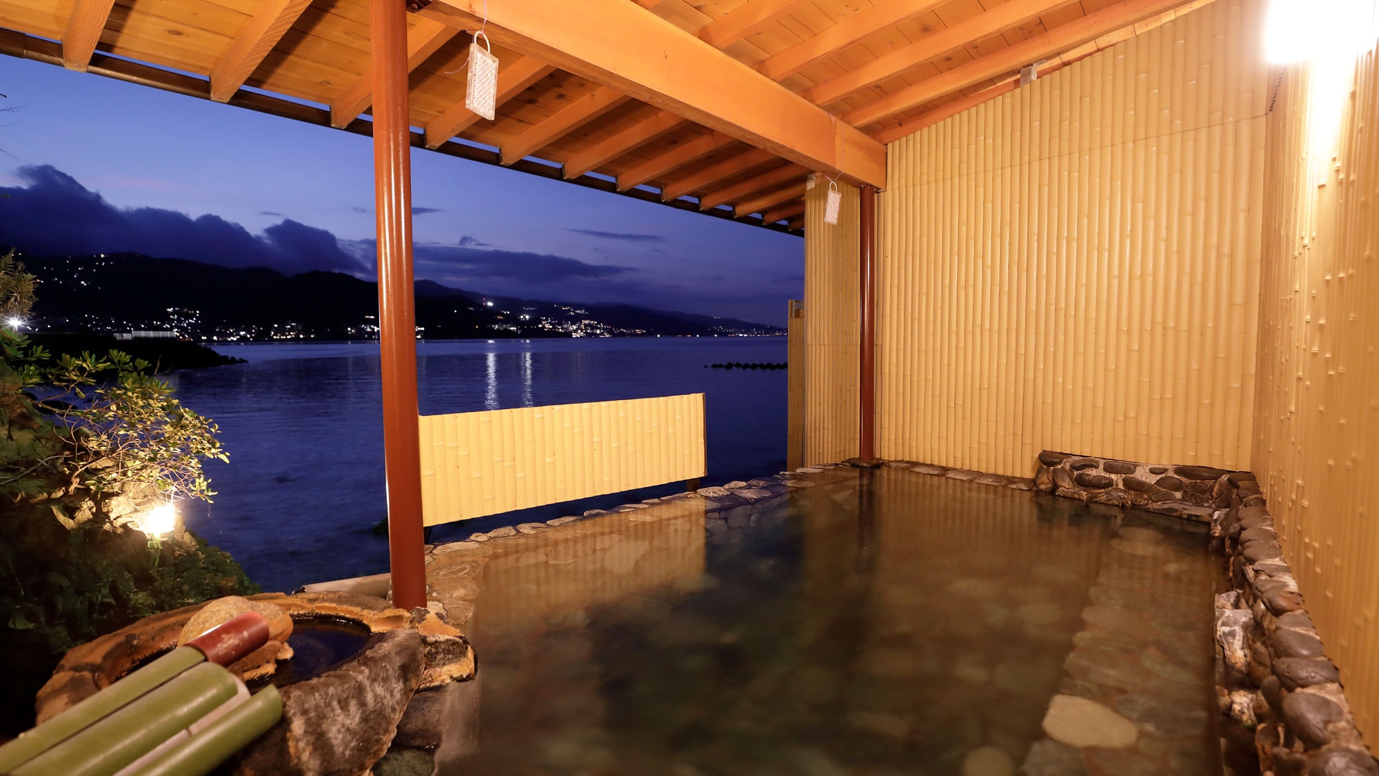 Large public bath with a night view