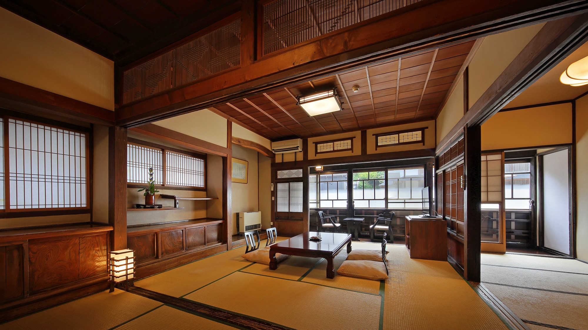 (River side guest room) Two adjoining Japanese-style rooms overlooking the hot spring town and the Ginzan River)