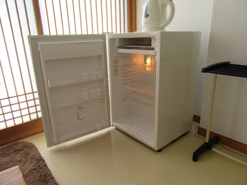 Empty refrigerators are installed in all rooms.