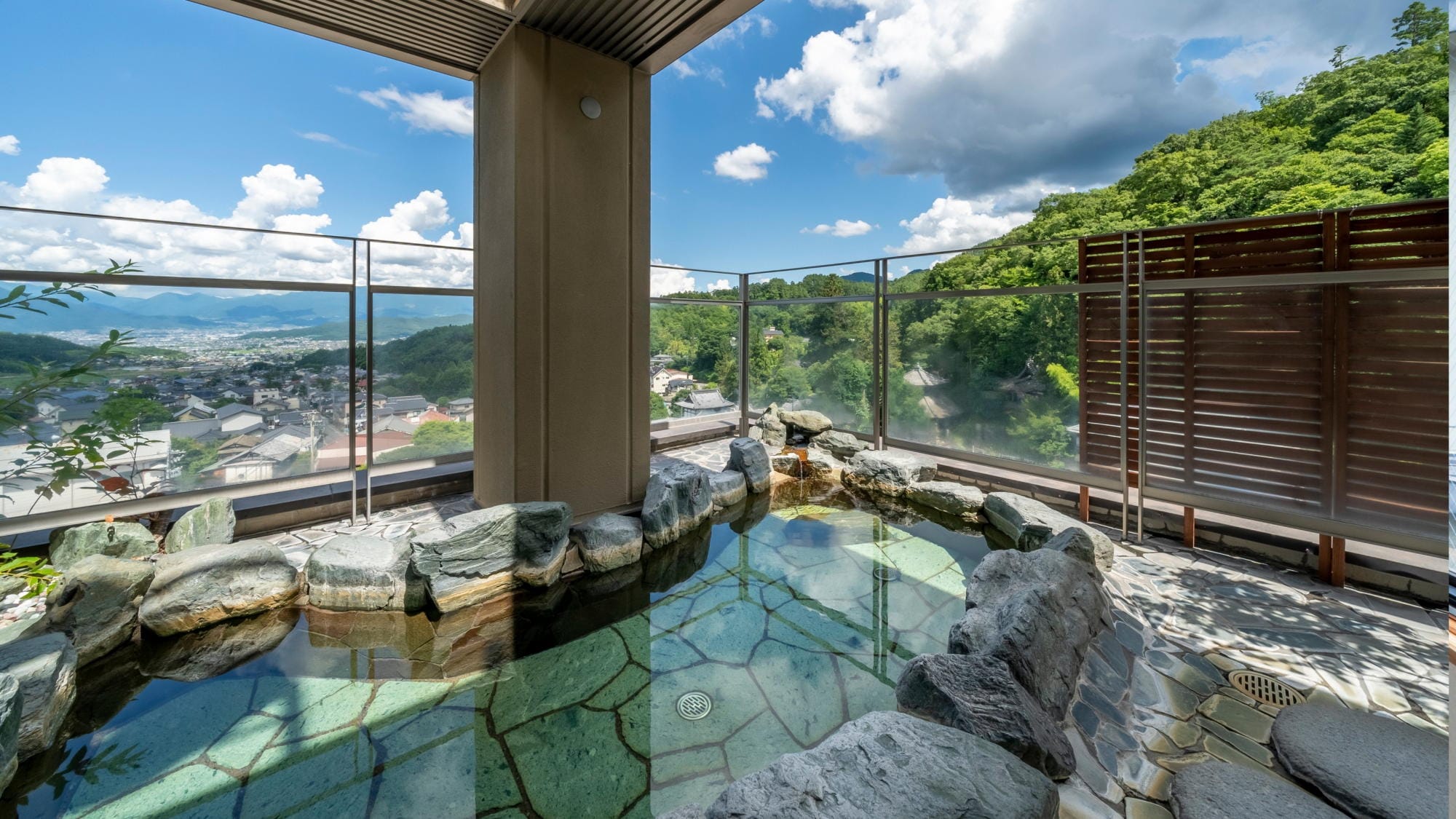 Open-air bath on the 7th floor overlooking Shiodaira and the Joshinetsu mountains