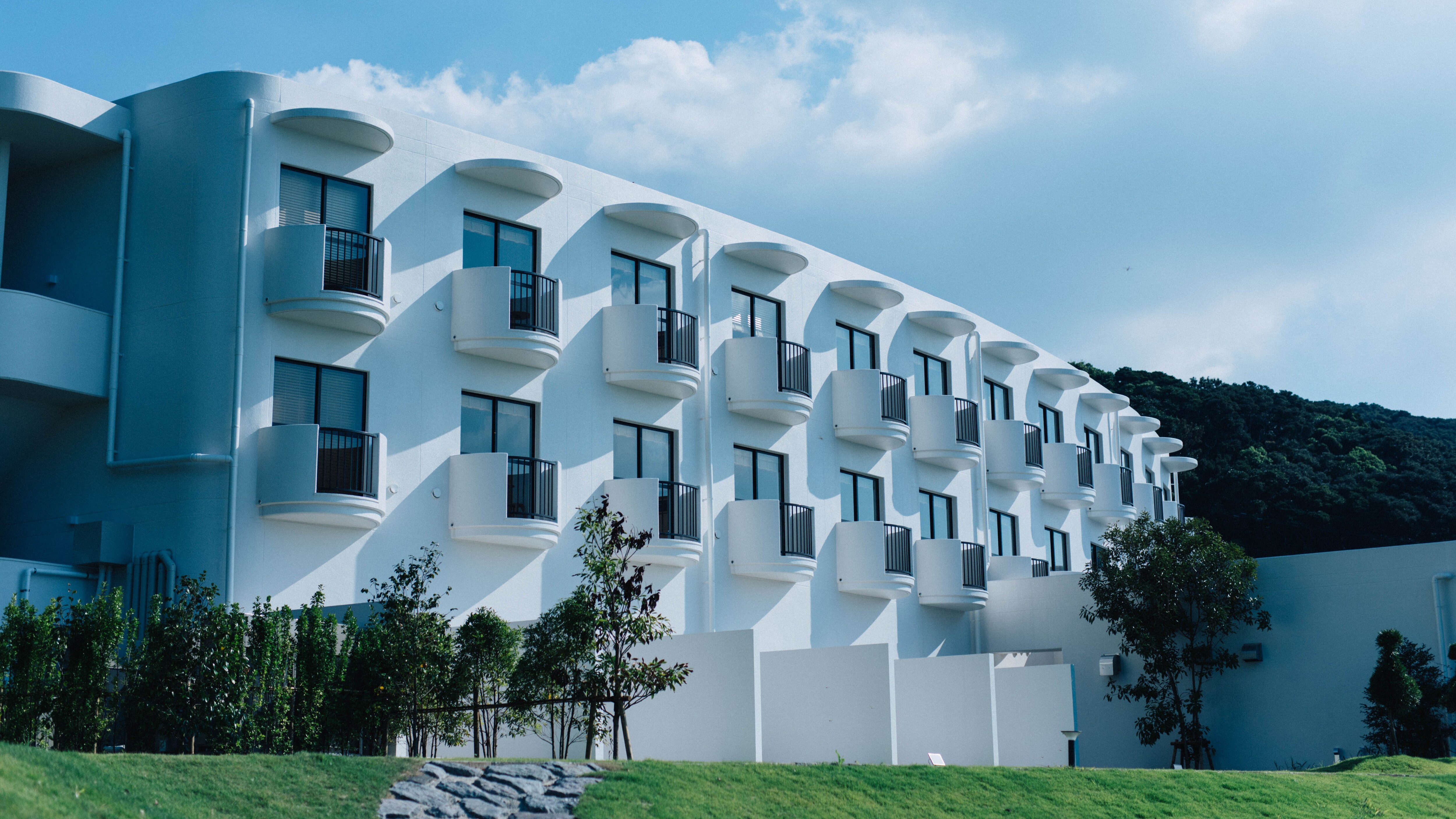West wing with twin rooms, double rooms, and loft rooms.
