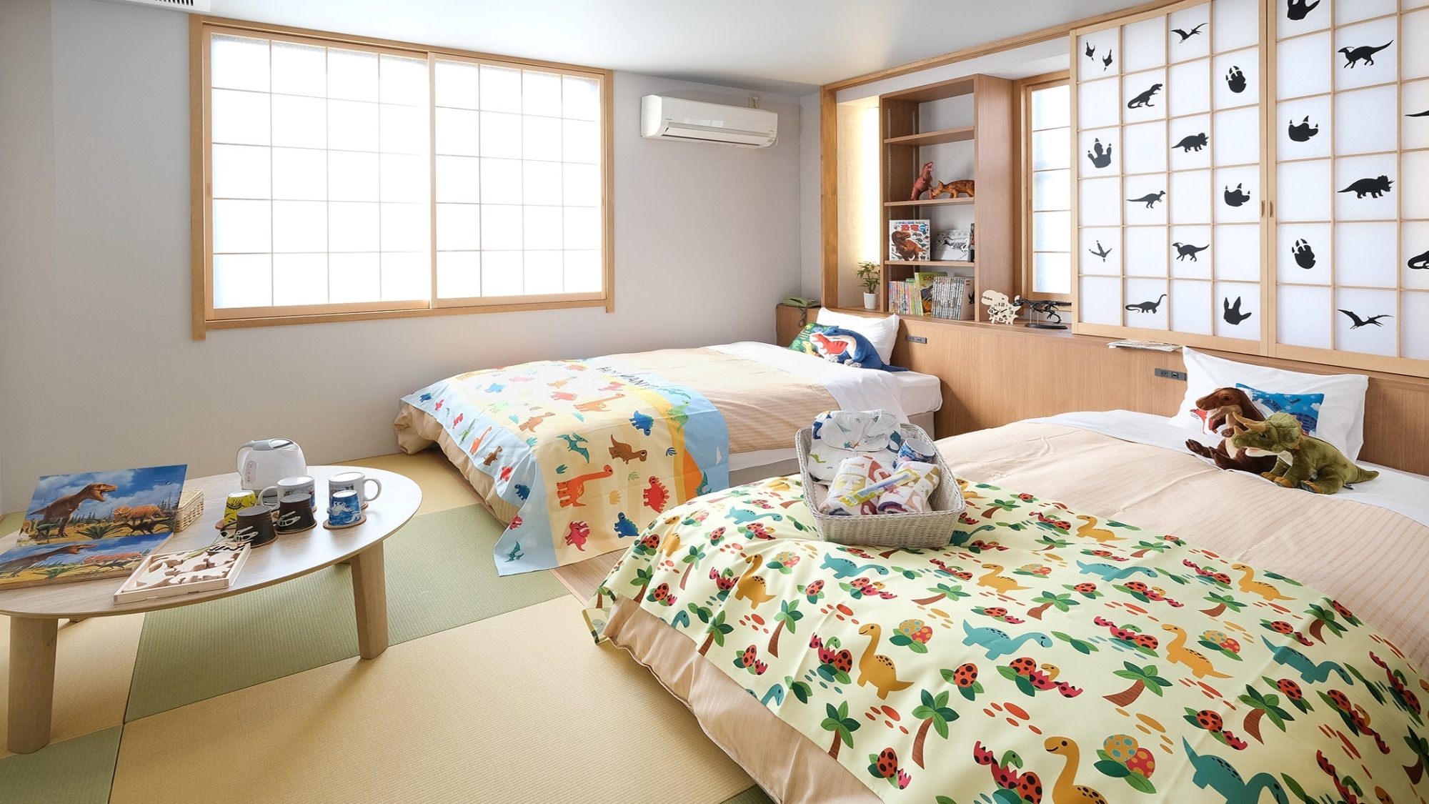 *[Dinosaur Room] Even the beds have dinosaur patterns!