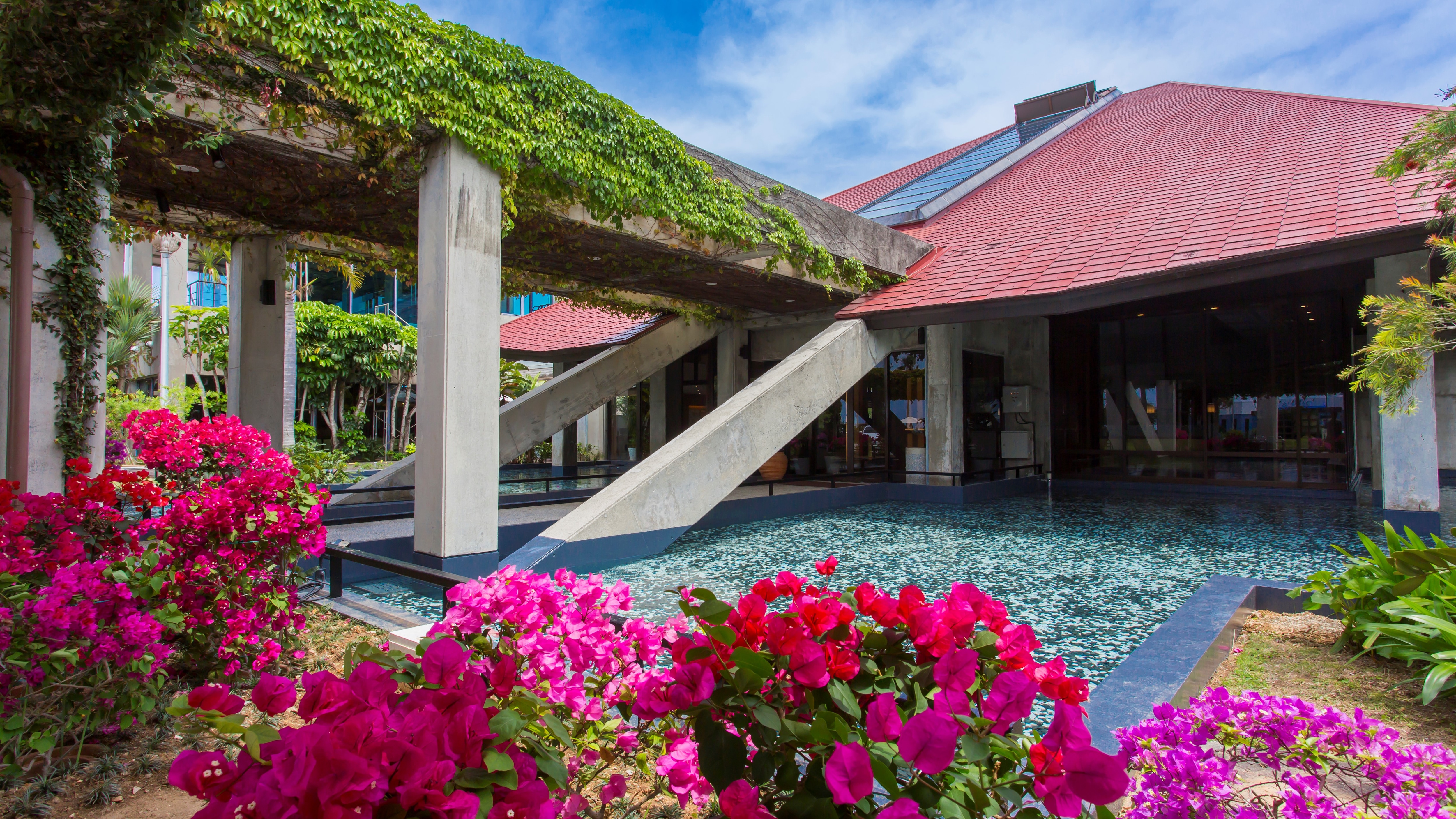 A resort surrounded by colorful tropical flowers all year round
