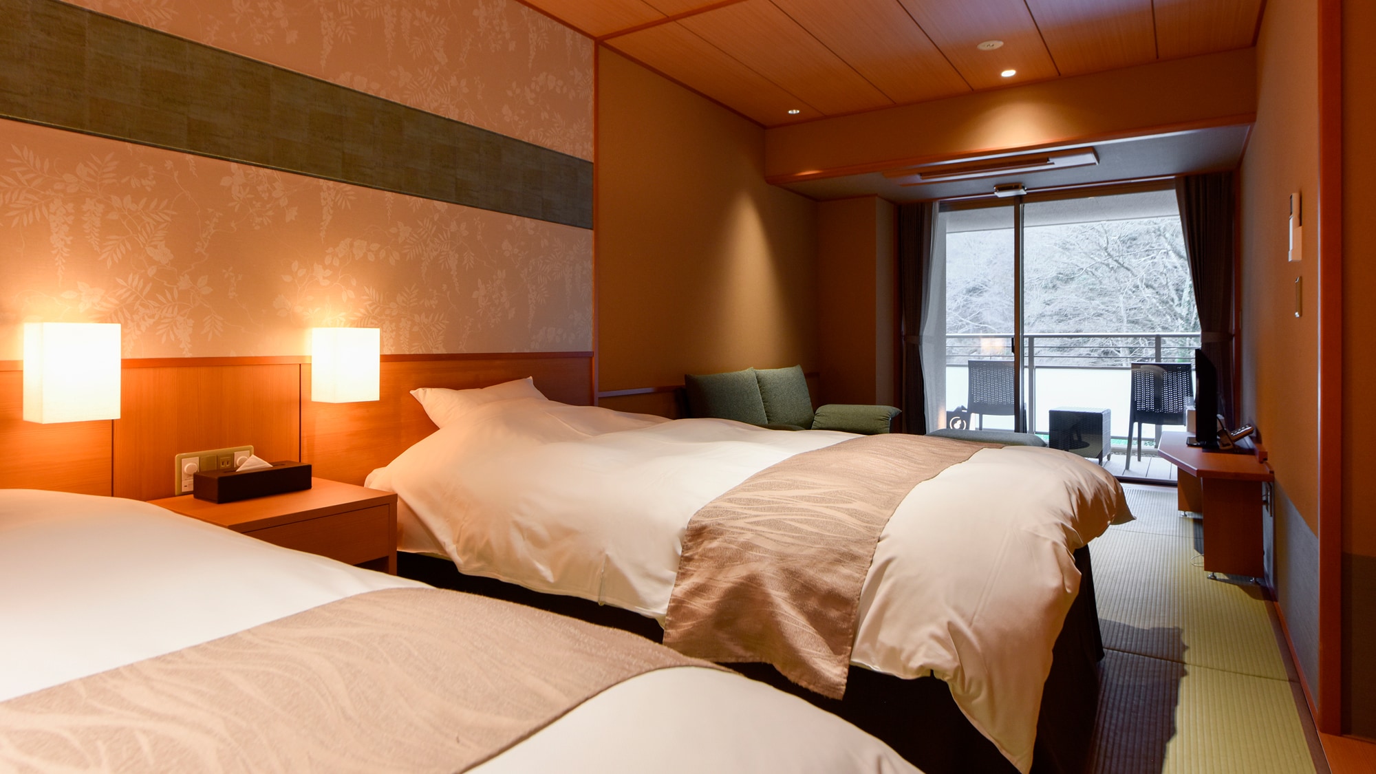 [Main building, Japanese-style room A with private source] Japanese-style room with twin beds, sofa and terrace.