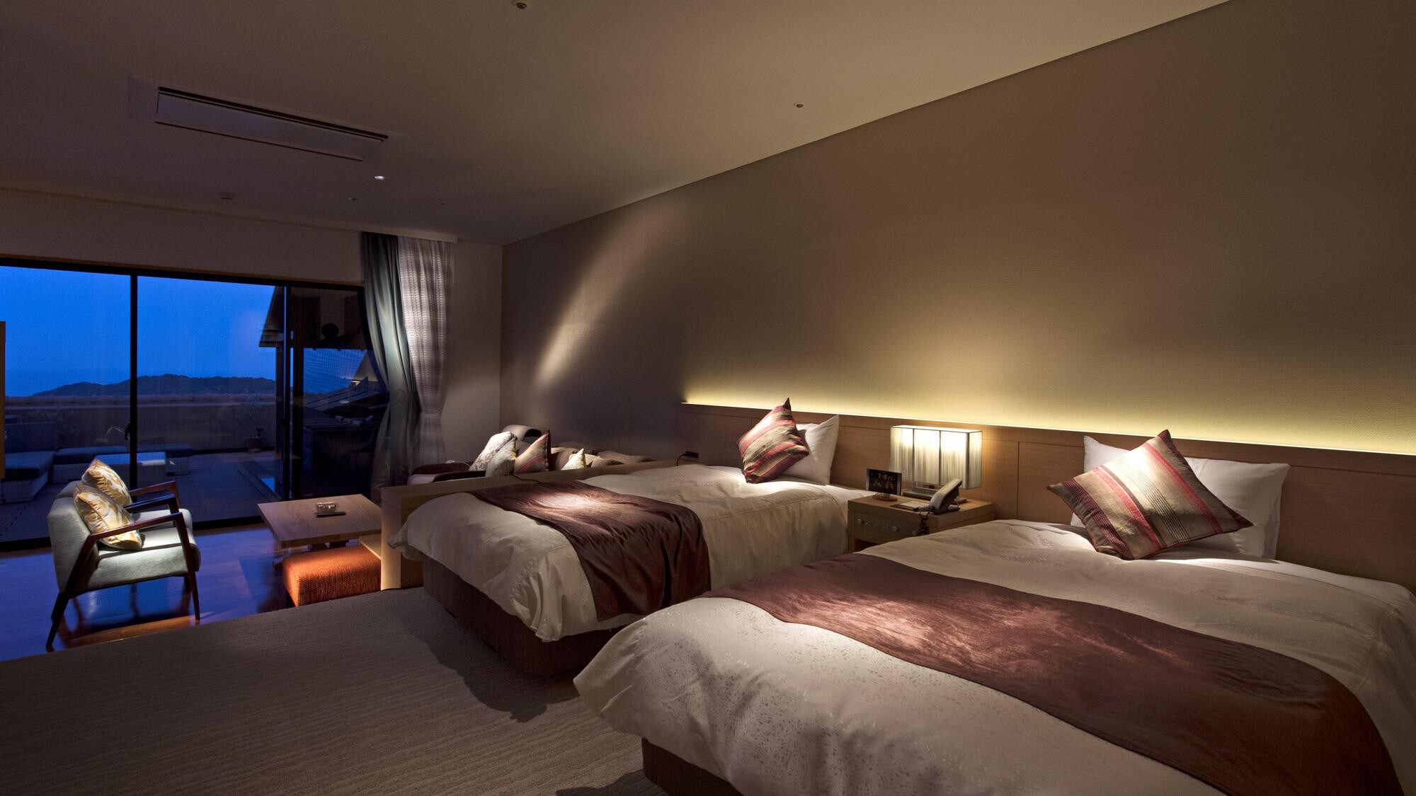 Terrace view of premium room with open-air bath (night)