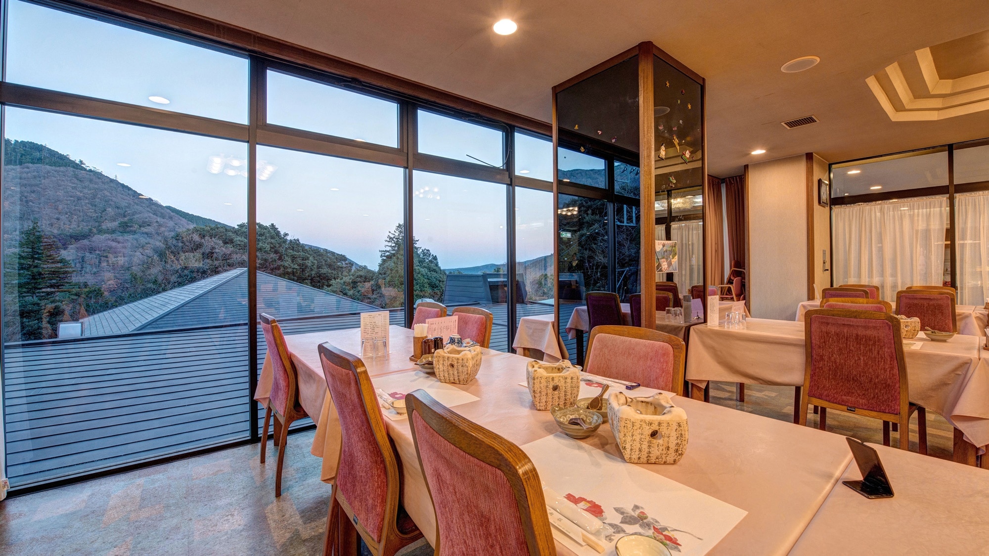*[Inside the building] A restaurant with large windows that give it an open feel.