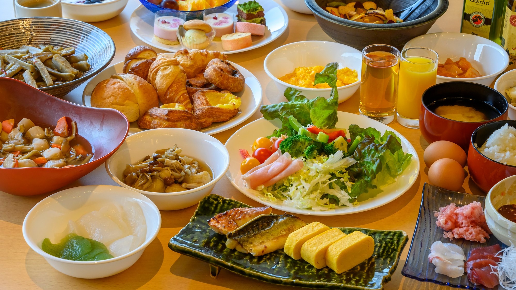 A colorful breakfast buffet. Enjoy a pleasant moment in the bright morning sunshine at the dining room with a fine view.