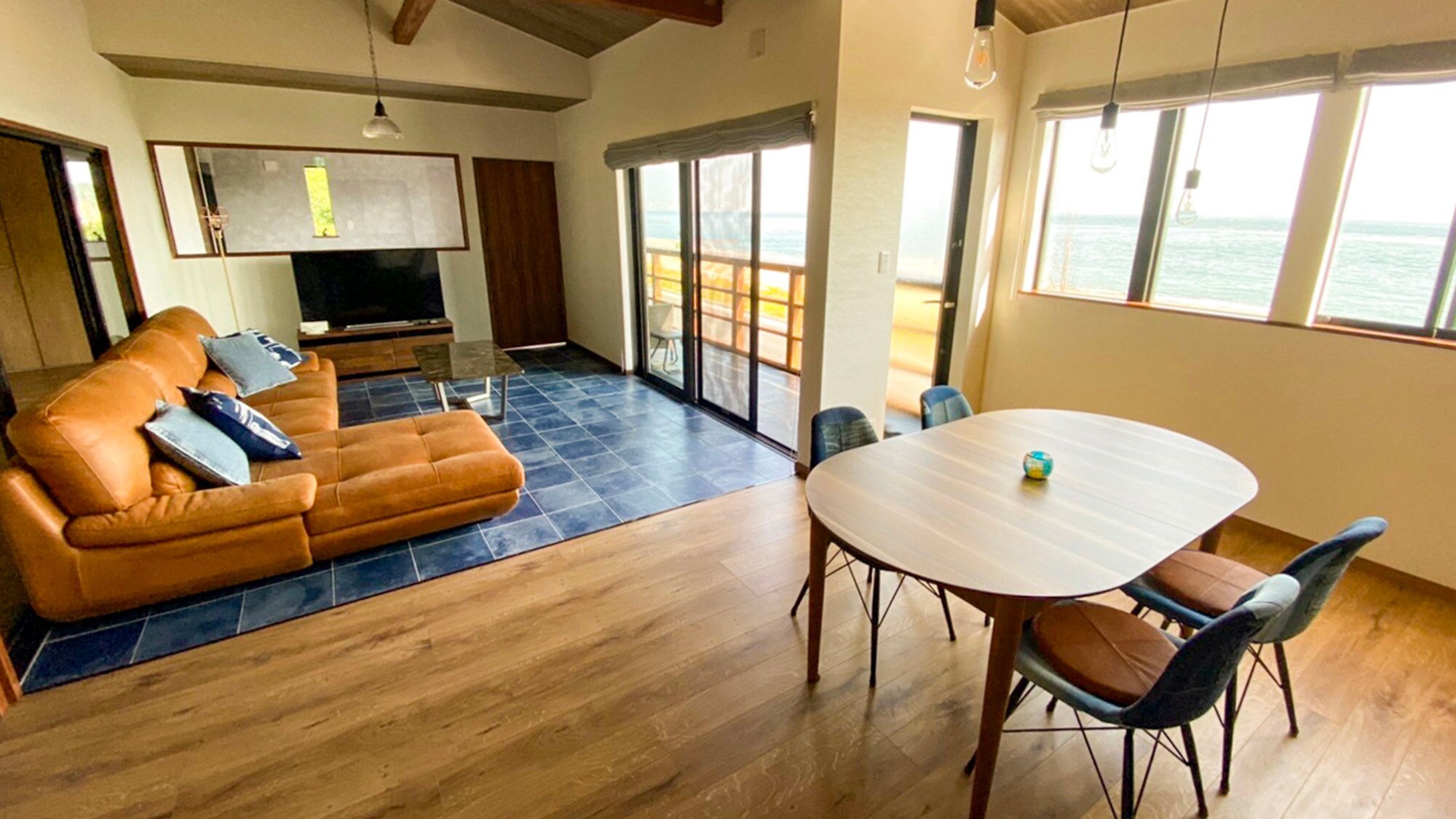 ・Living and dining room with high ceilings and an open feel