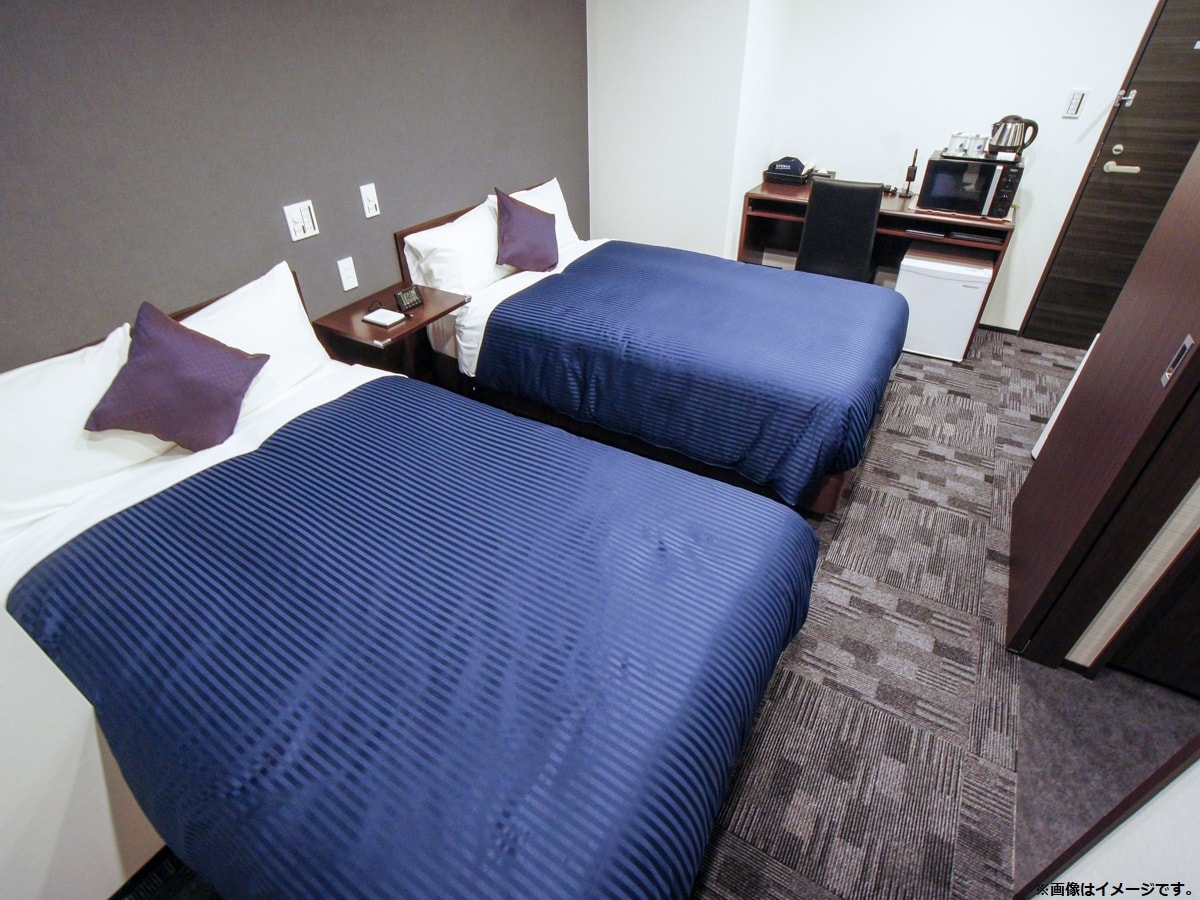 Kamar Twin Semua kamar dilengkapi dengan tempat tidur slumberland.