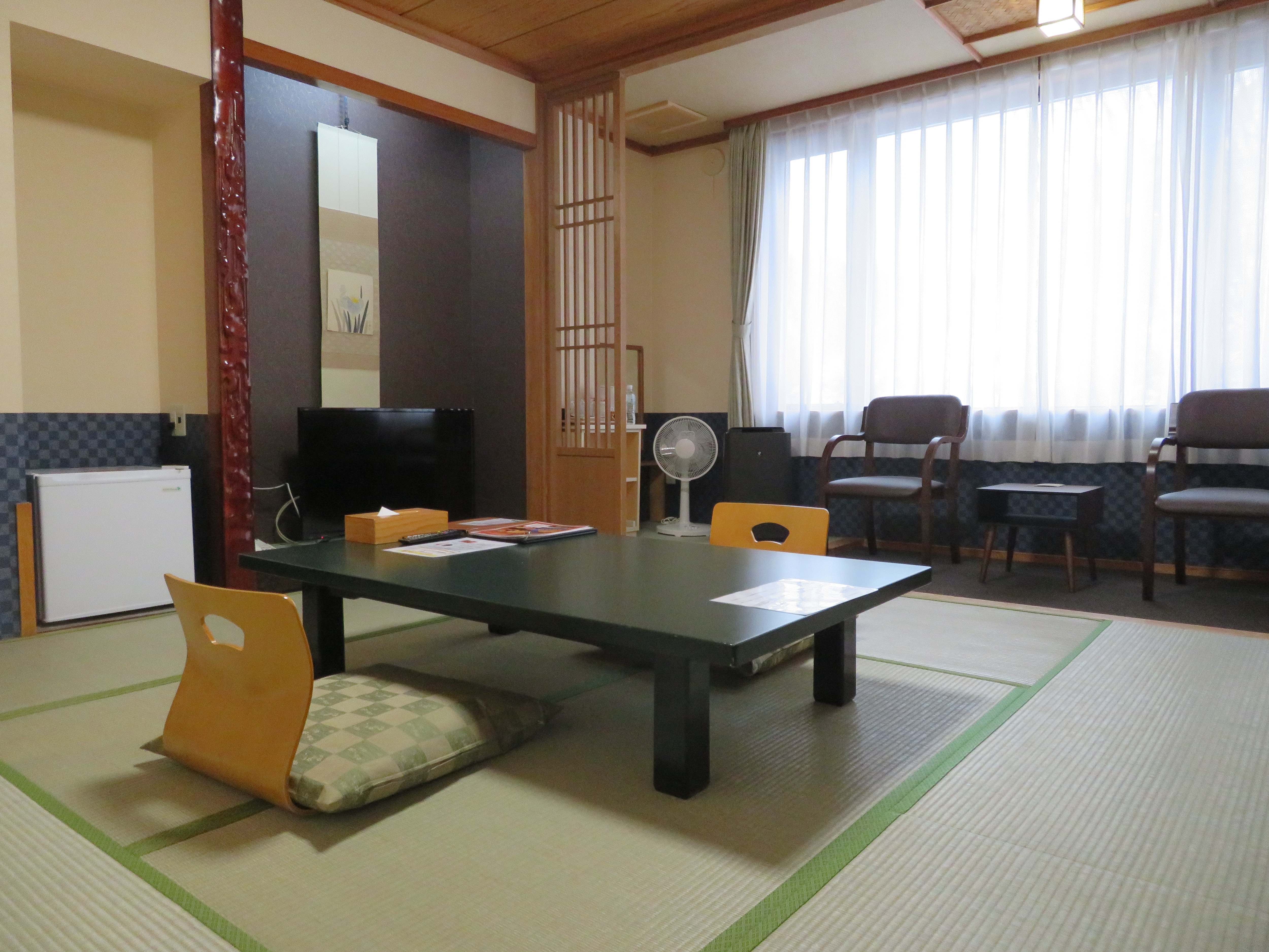 Japanese-style room with 8 tatami mats and shower booth