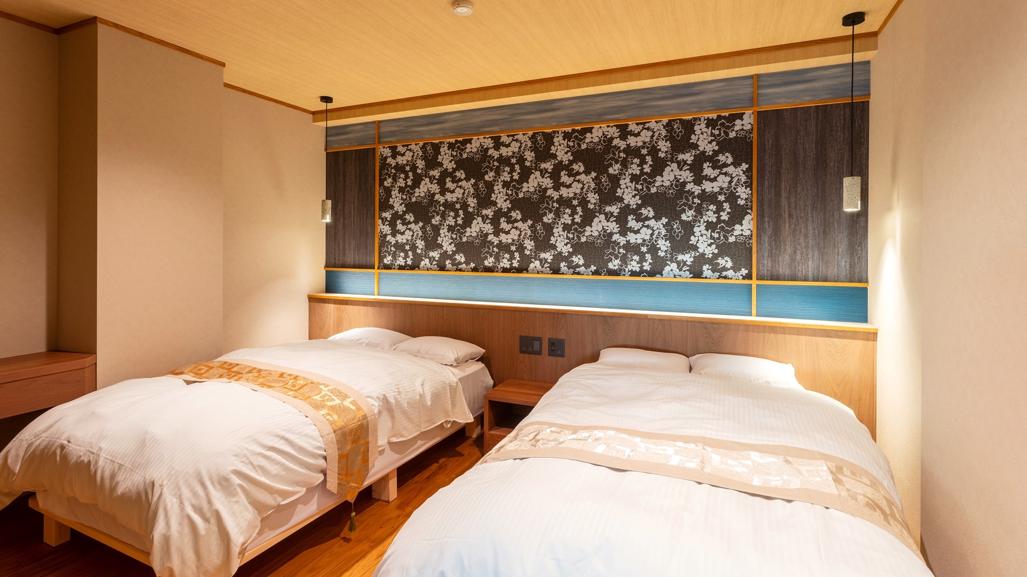 *[Bedroom] The bedside table is designed to resemble the sky and a lake, and there is also a desk space.