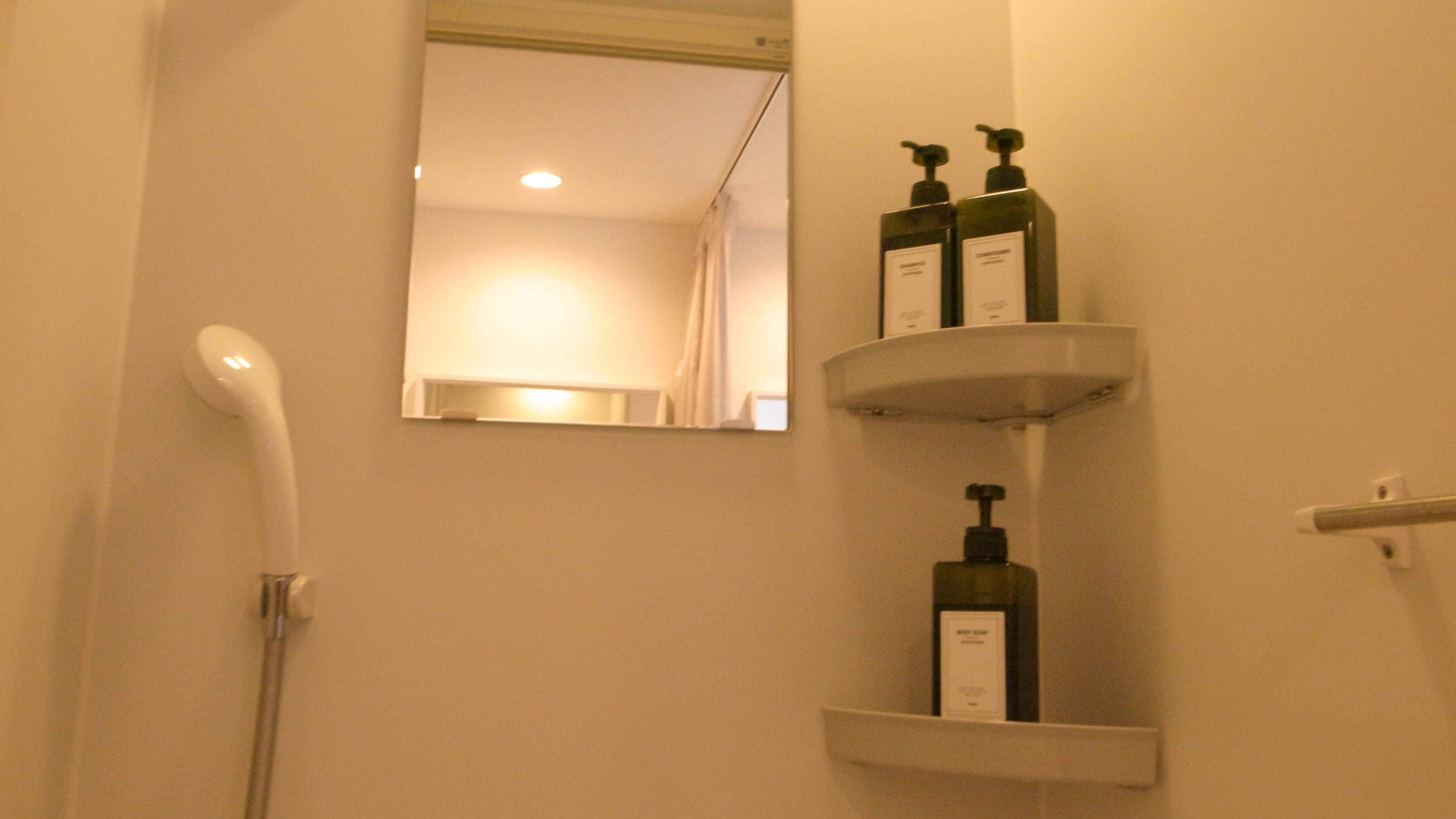 Shampoo, conditioner, and body soap are provided in the shared shower room and bathroom in the fourth room.