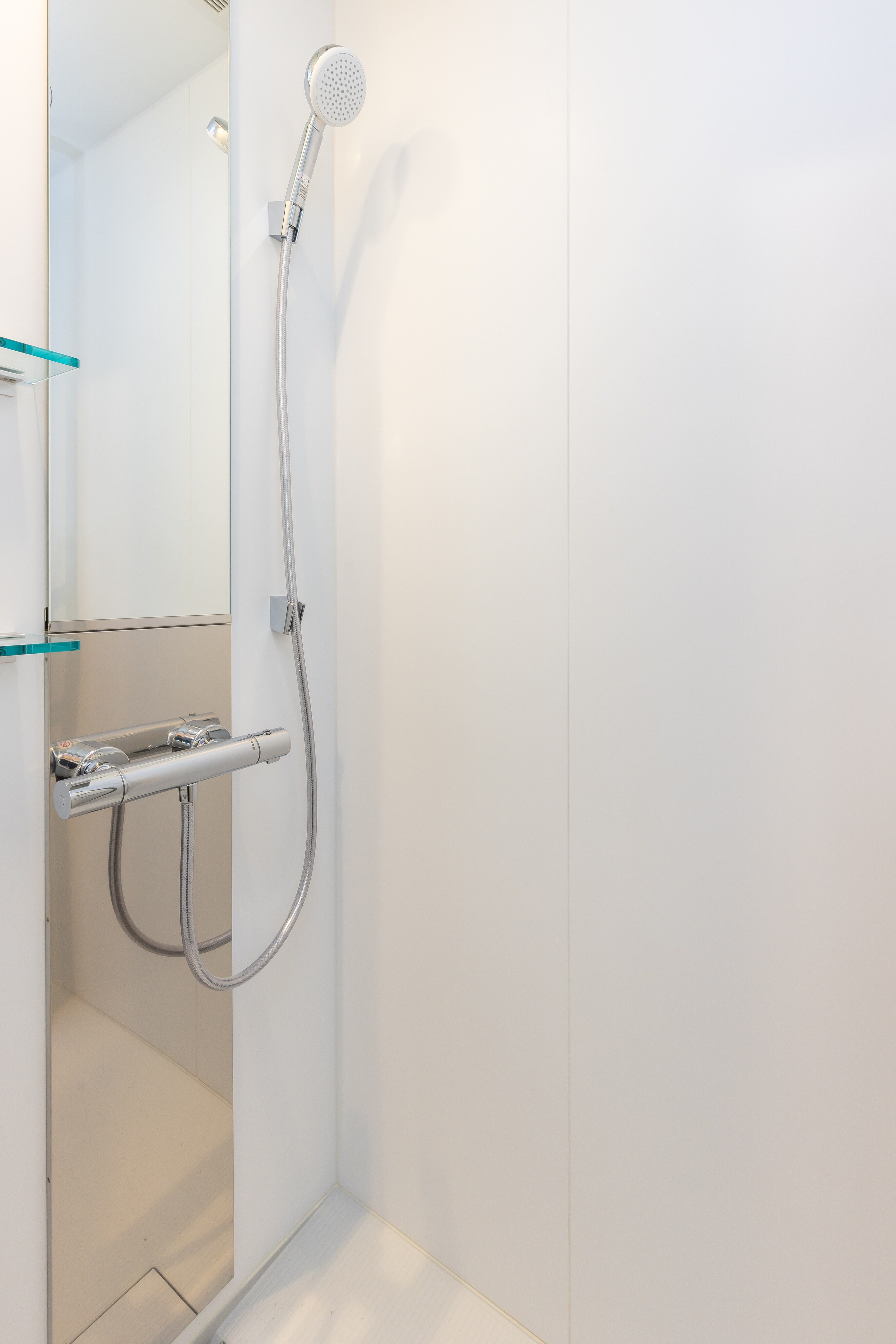 Each room is equipped with a private shower booth. *There is no bathtub.