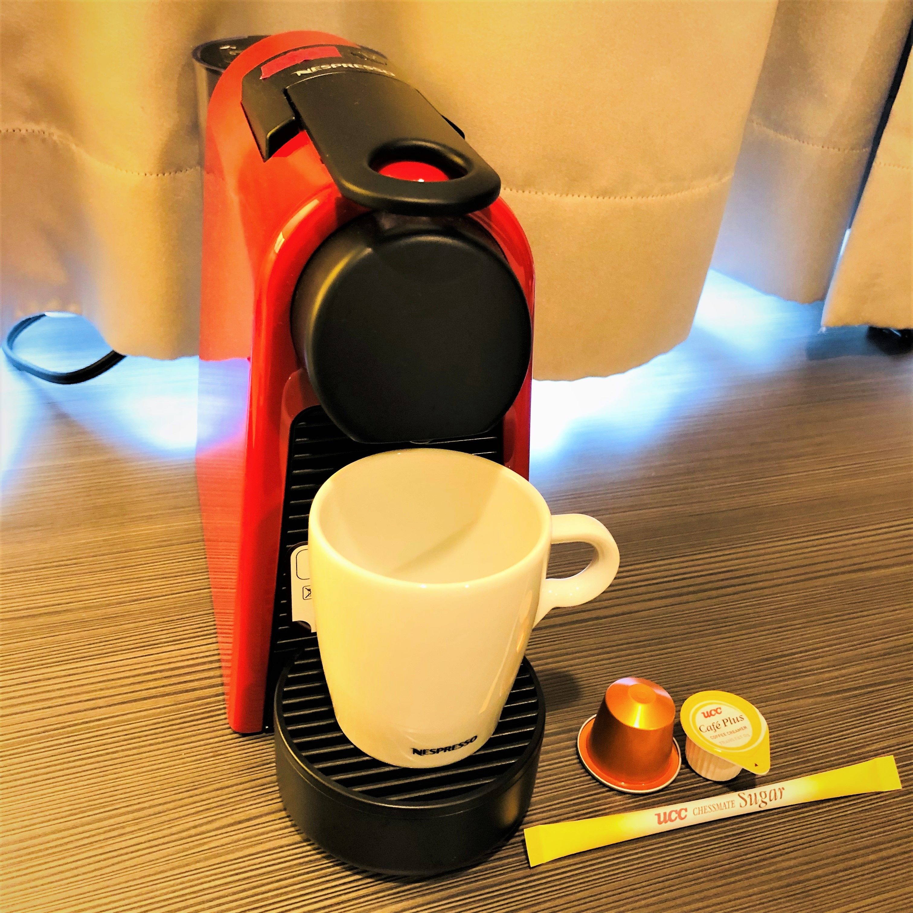 Desk in a room with a Nestle coffee machine