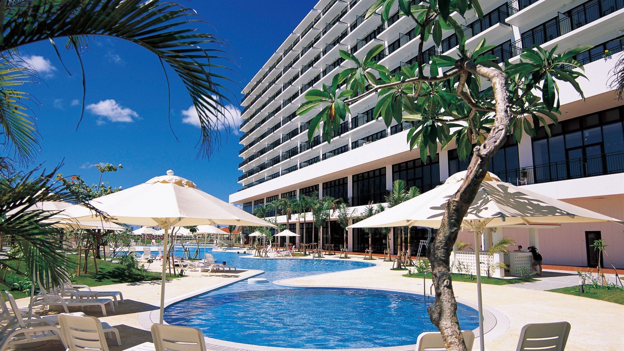 Garden pool and hotel exterior