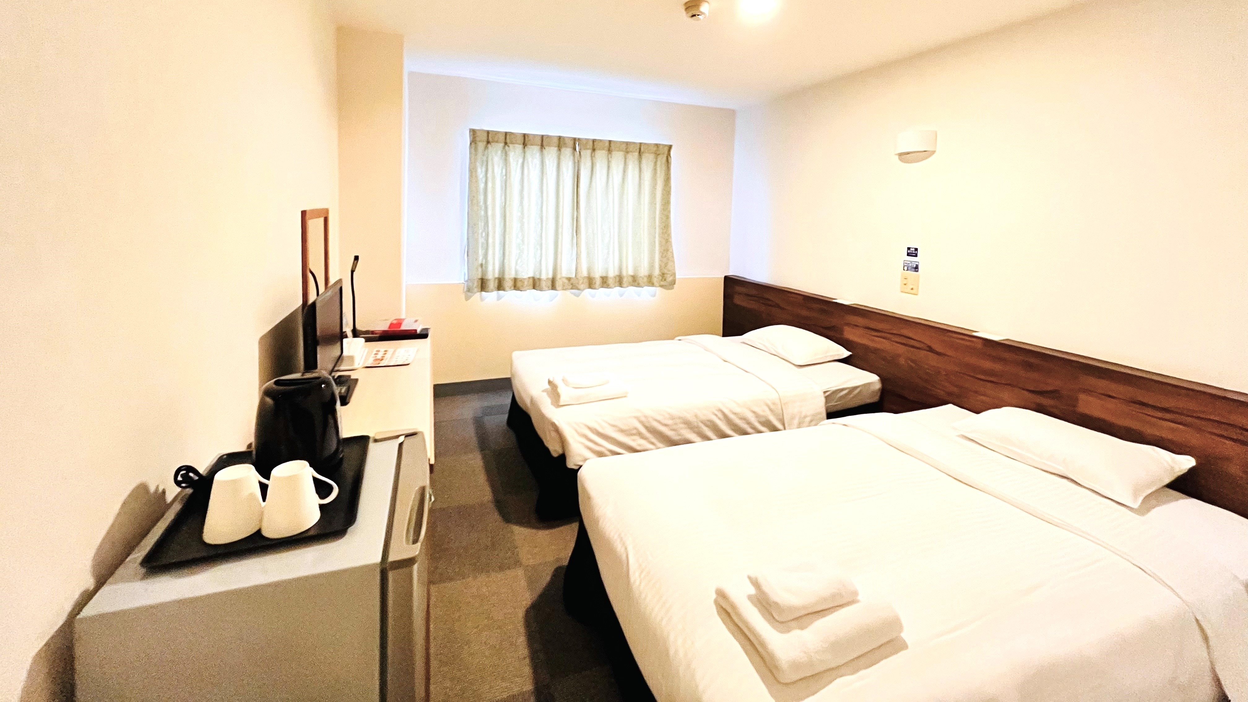 【雙床房】自然採光充足，功能性與舒適性兼具的客房。