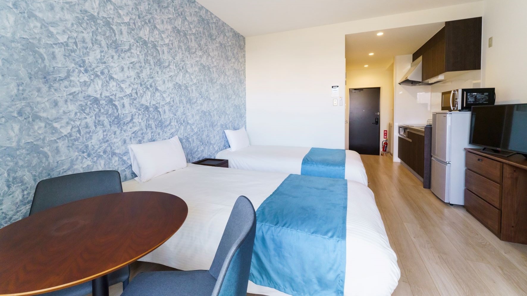 The room facilities are designed to make the hotel a convenient base for travelers or for long-term stays.