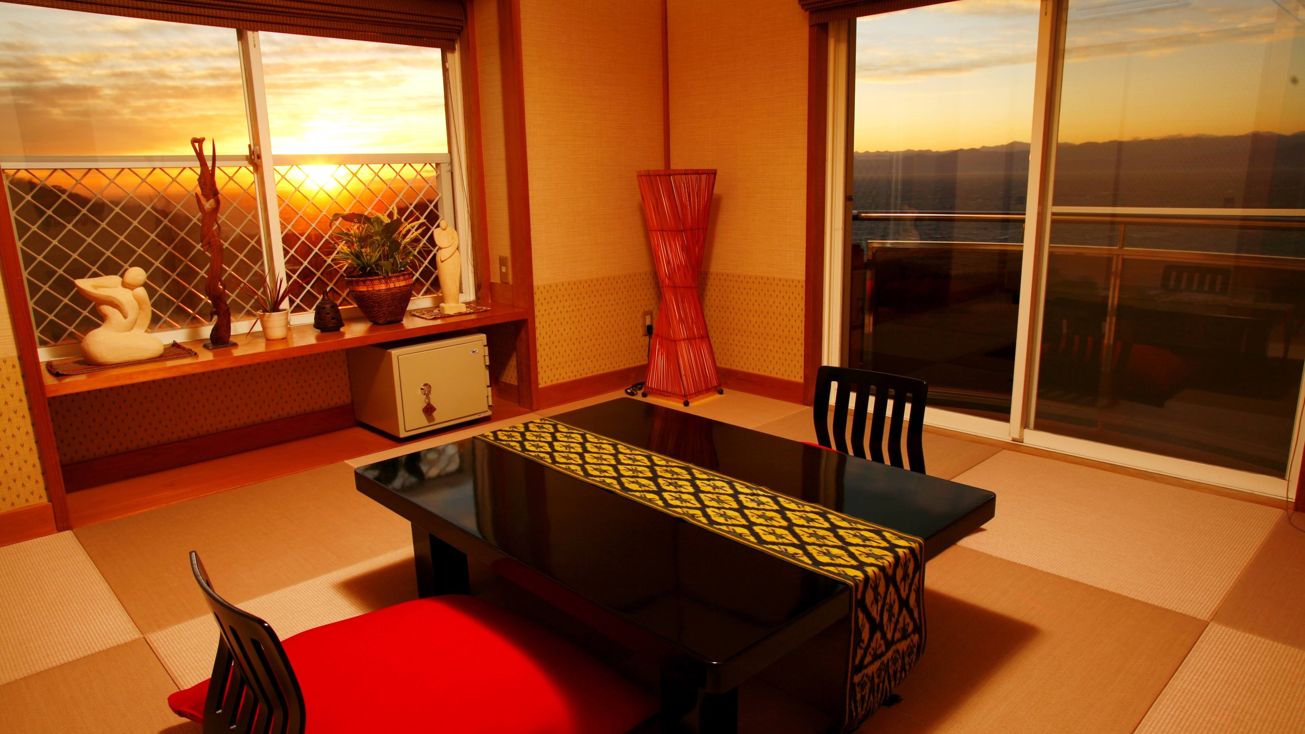 A corner room with a beautiful sunset and ocean view (example)