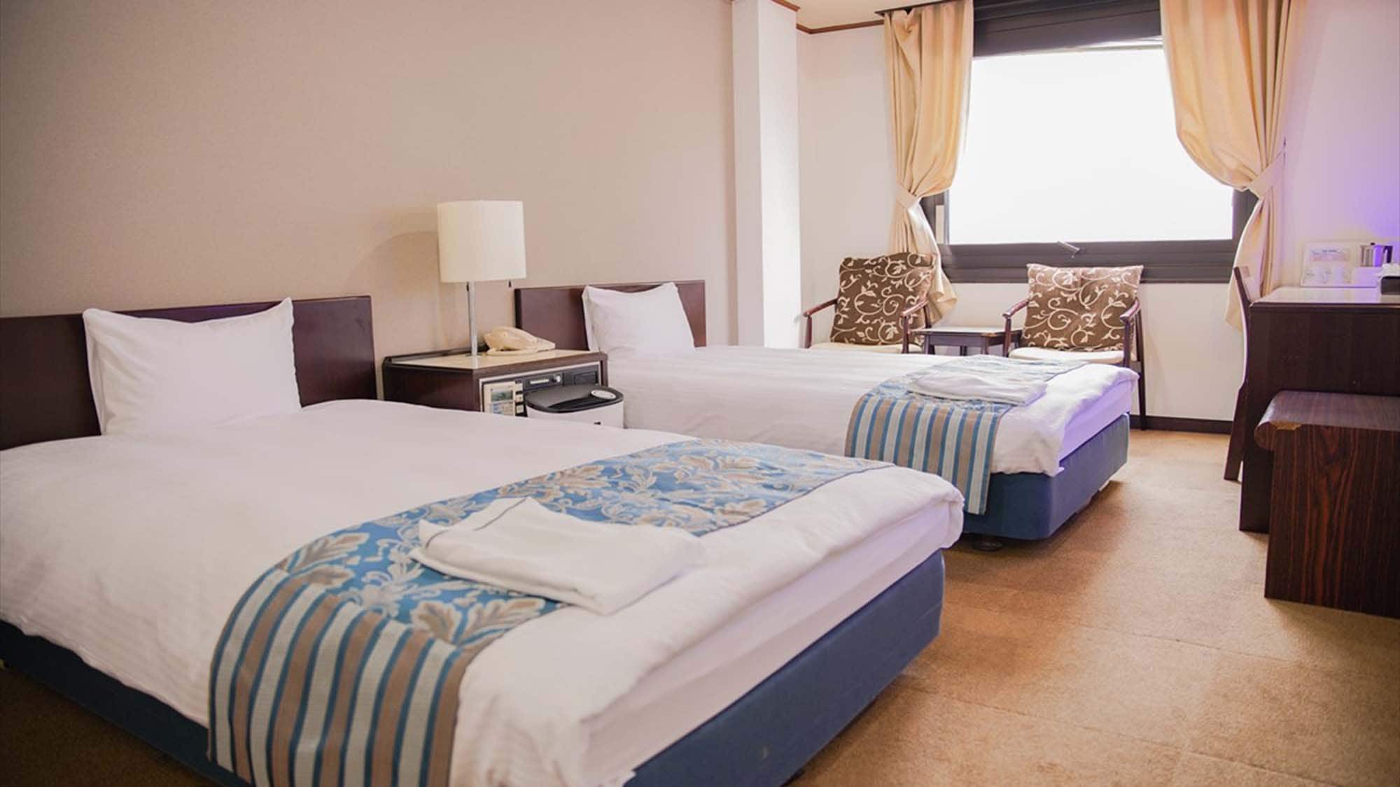・ An example of a family room: Two semi-double beds are available in the room on the second floor.