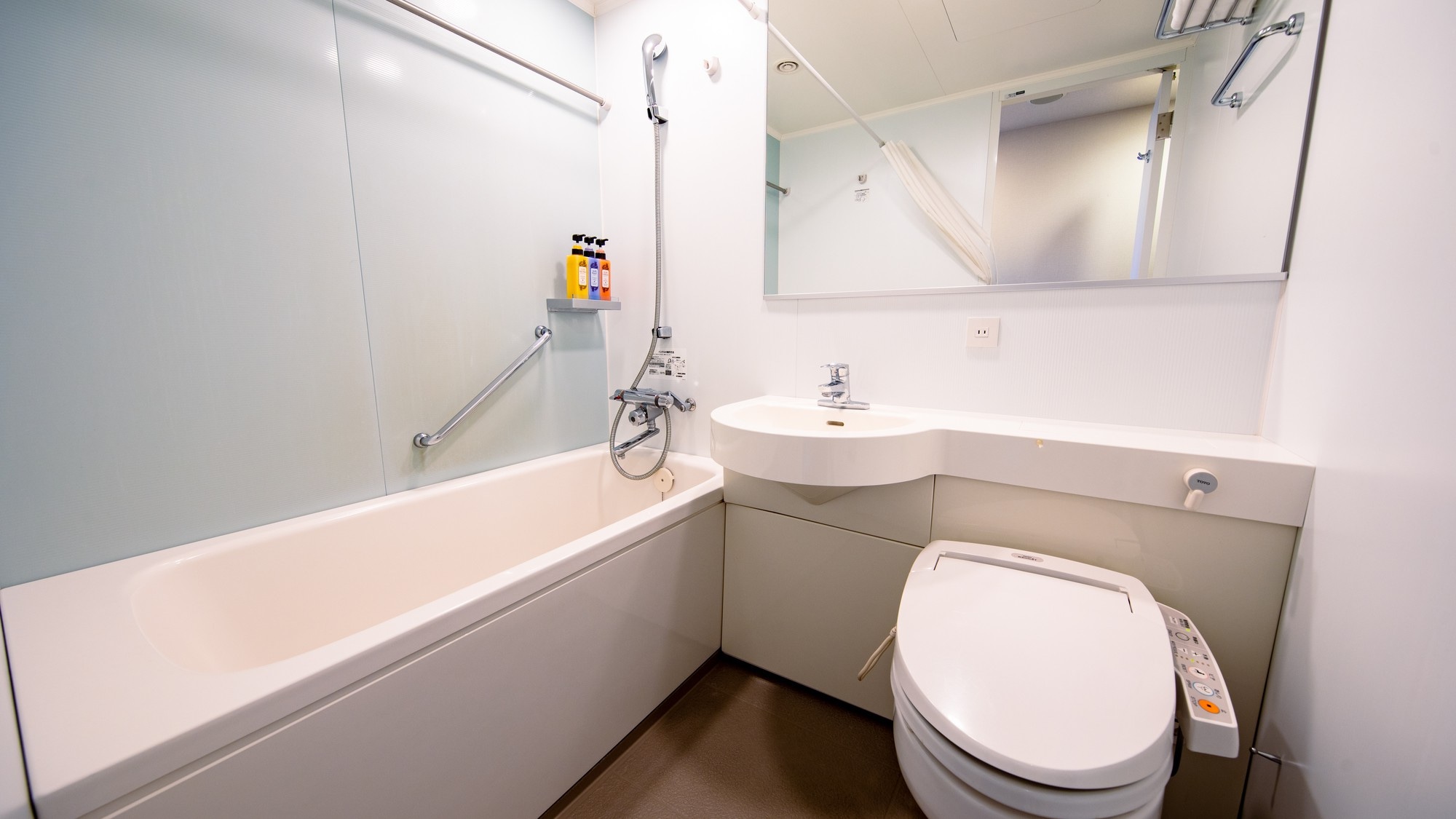 The bathtub is a little wider and you can stretch your legs comfortably.