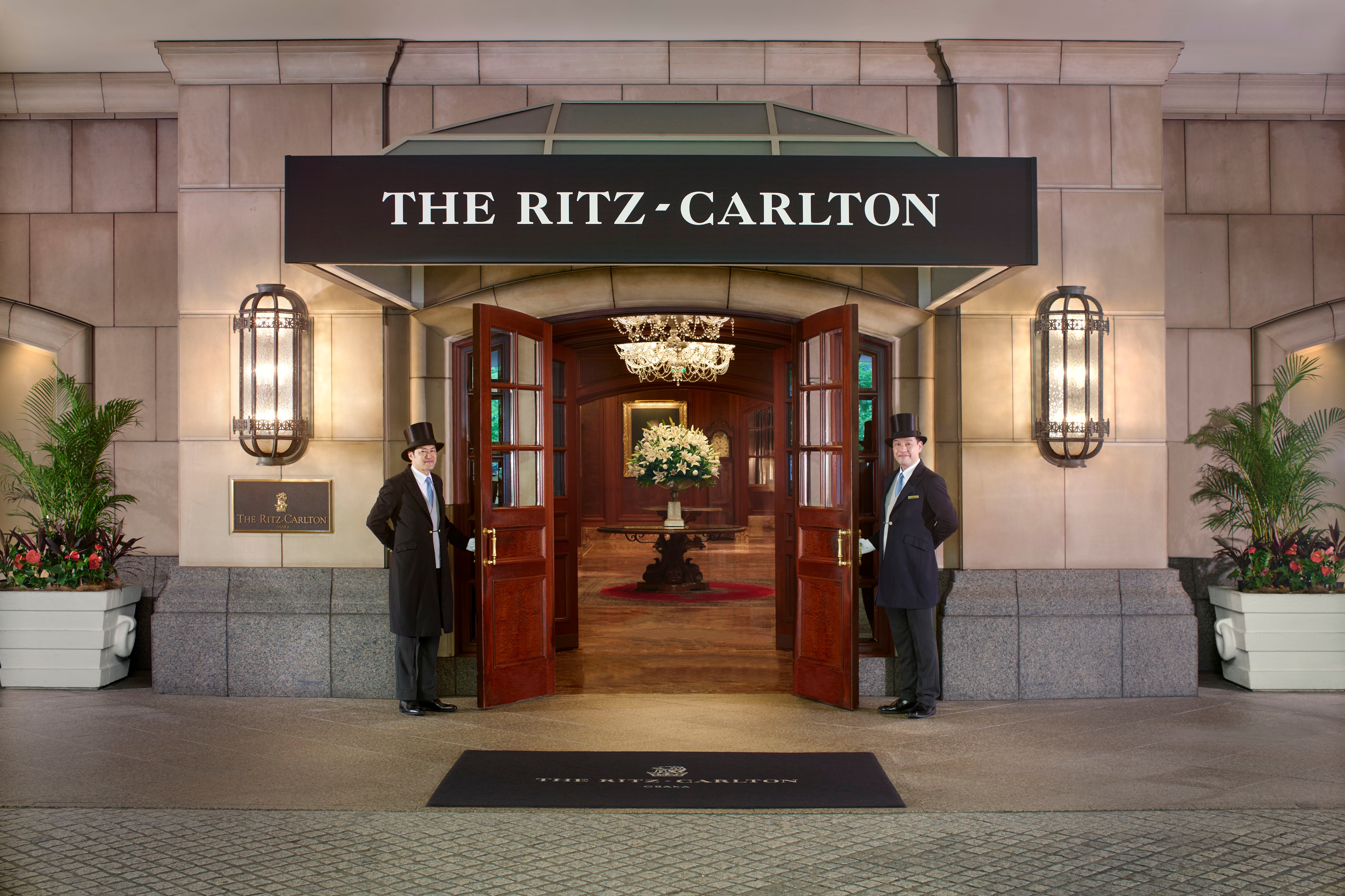 A doorman in a top hat opens the heavy doors and leads you into an elegant space reminiscent of a British aristocratic mansion.