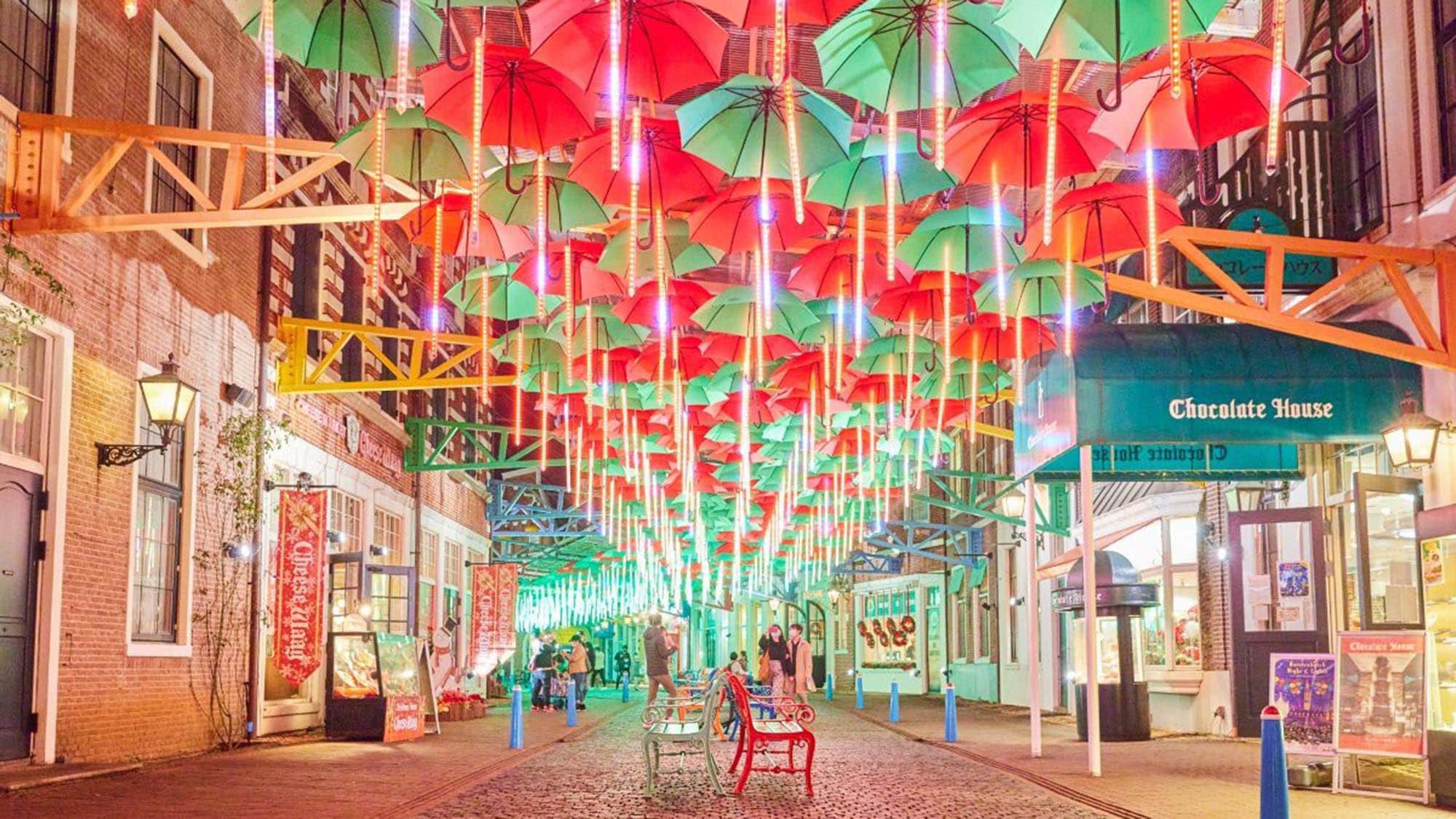 Approximately 700 umbrellas spread out overhead in Christmas colors.
