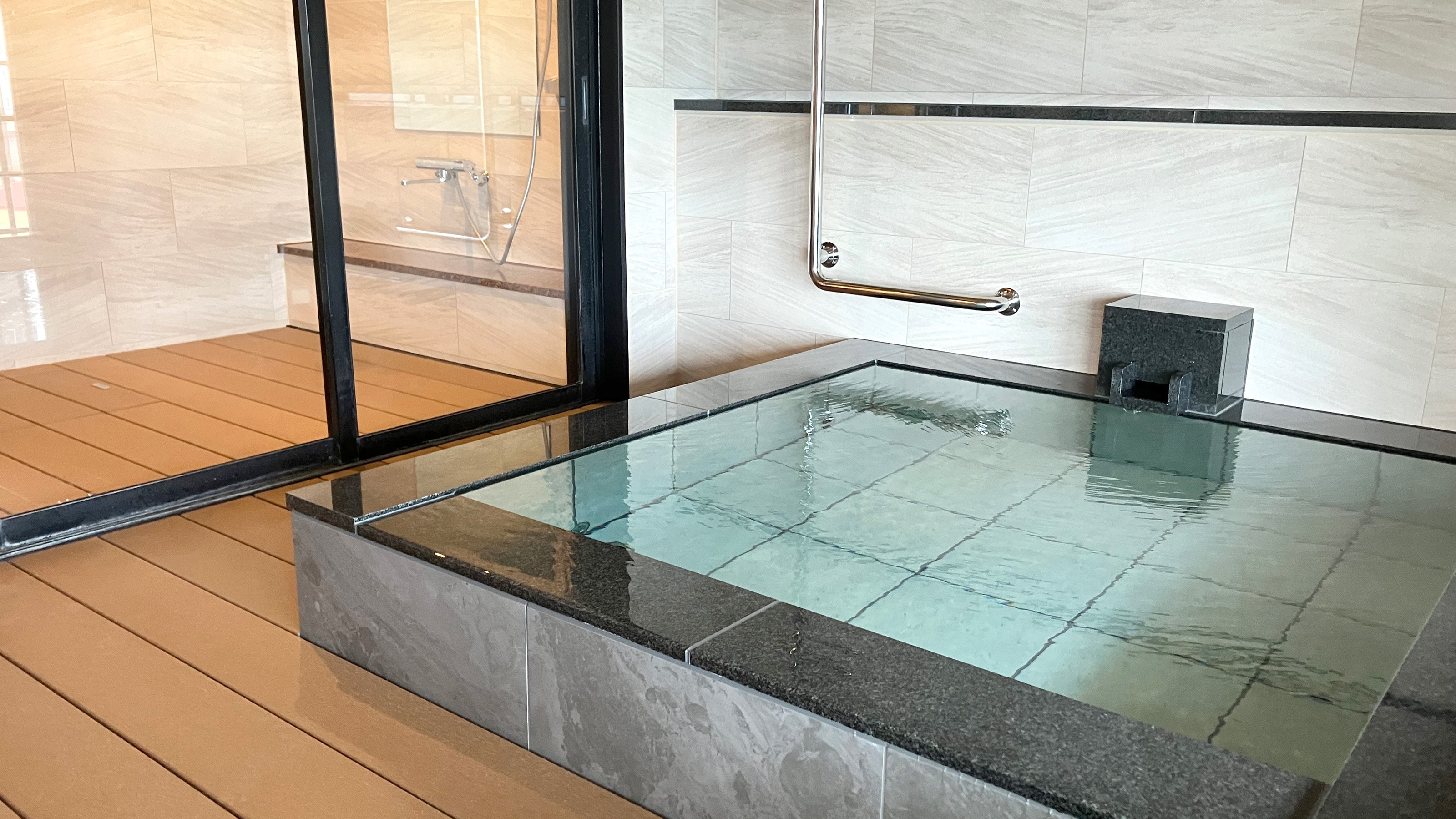 Renovated riverside guest room with open-air bath