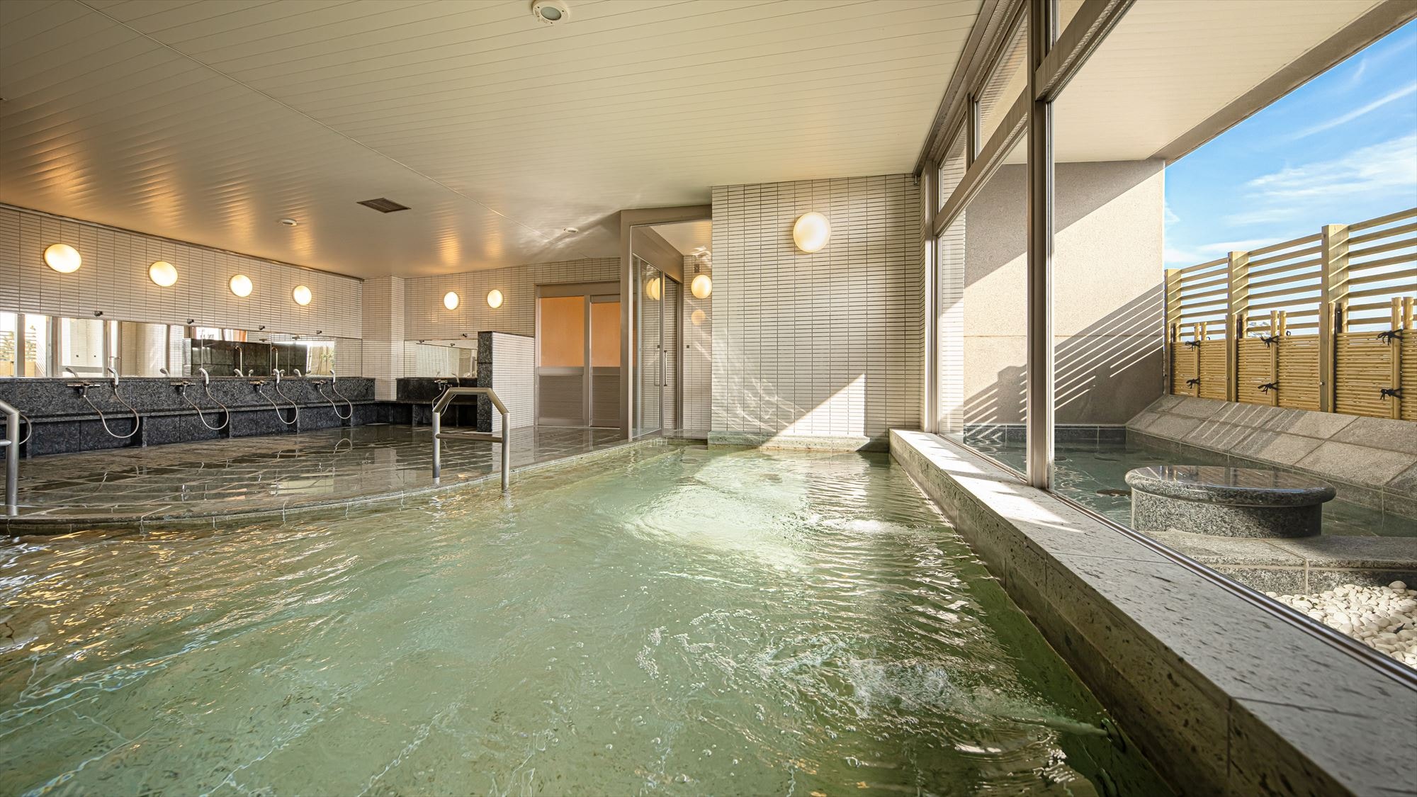 Large public bath with a view of the outside