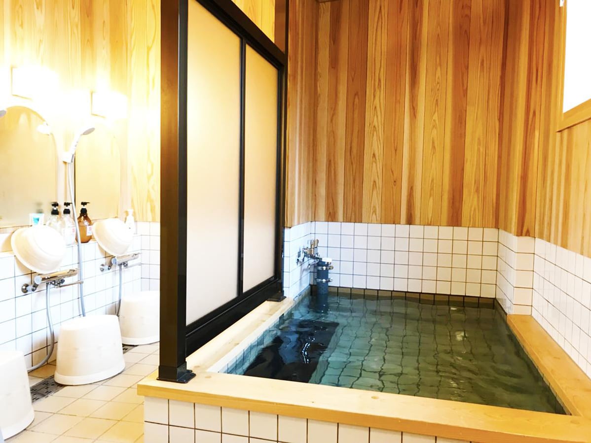 Large communal bath with cypress scent