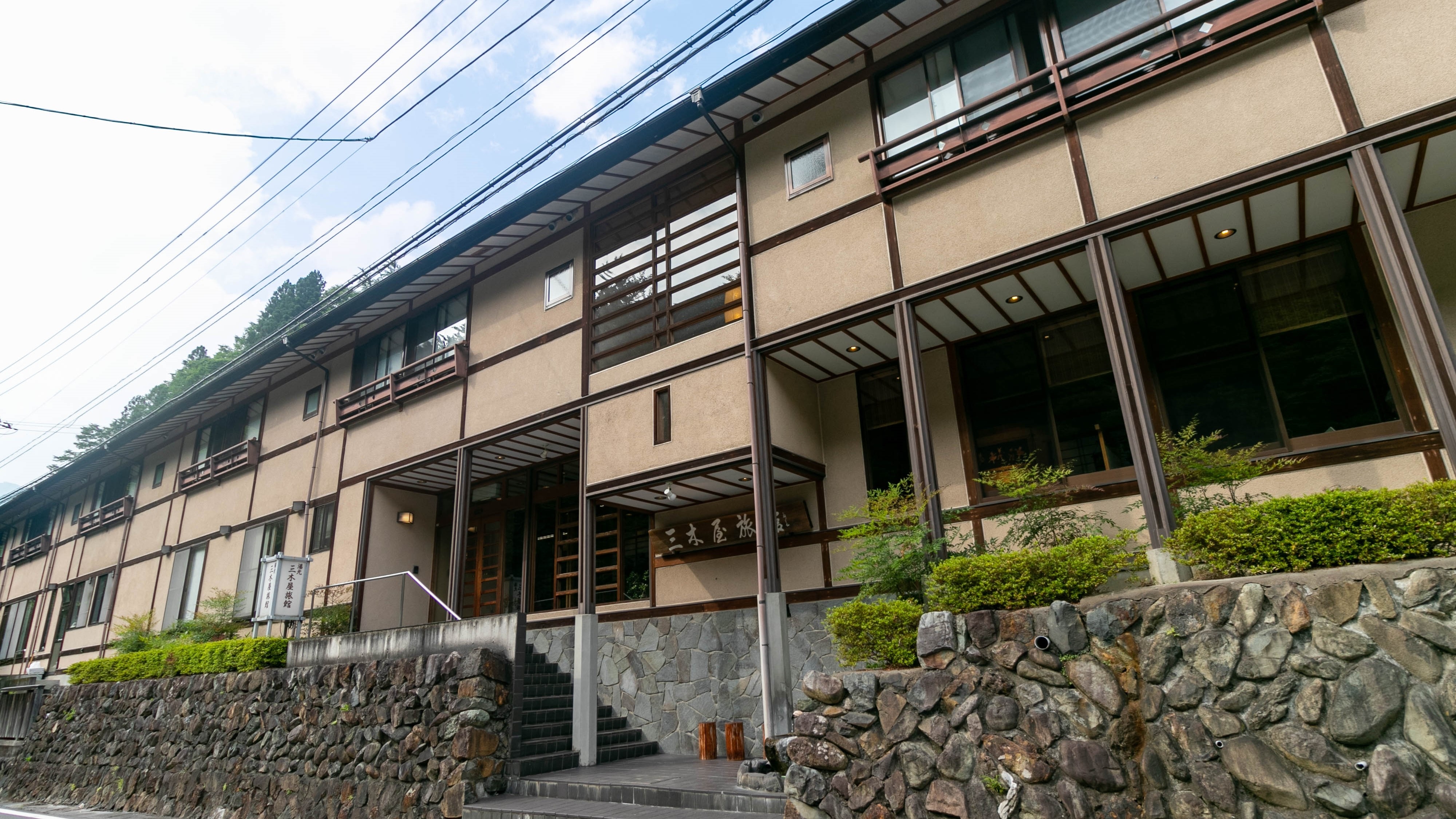 ・Exterior of Mikiya Ryokan, a riverside inn