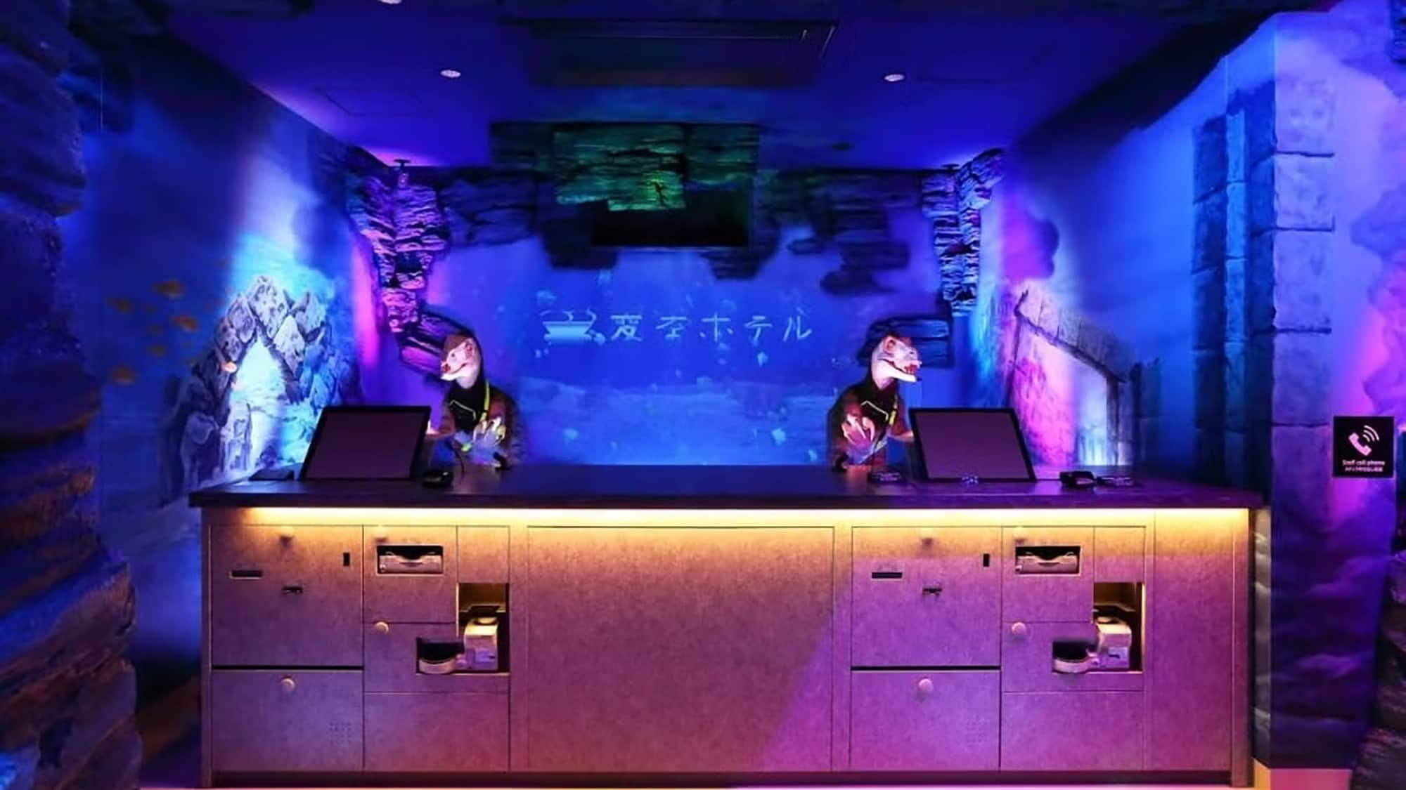 [A dinosaur robot welcomes you at the ocean-like front desk]