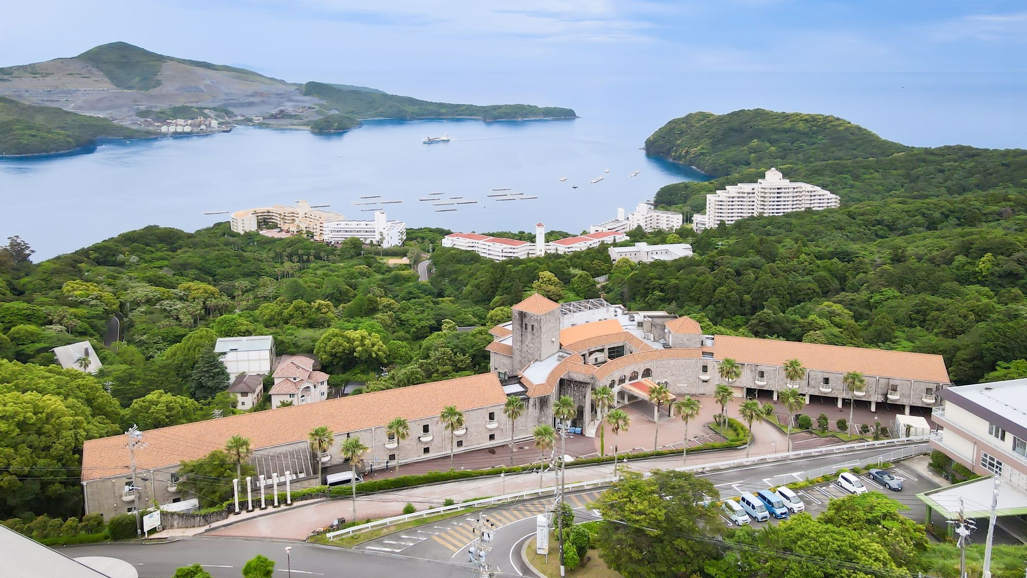 A Southern European-style resort hotel located on a hill overlooking Toba Bay.