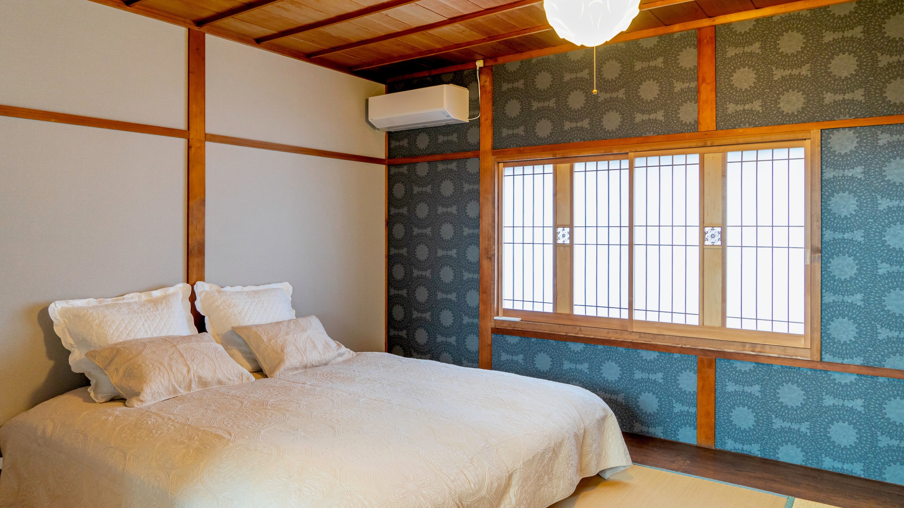 Bedroom on the second floor (queen size with two single beds joined together, accommodating two people)