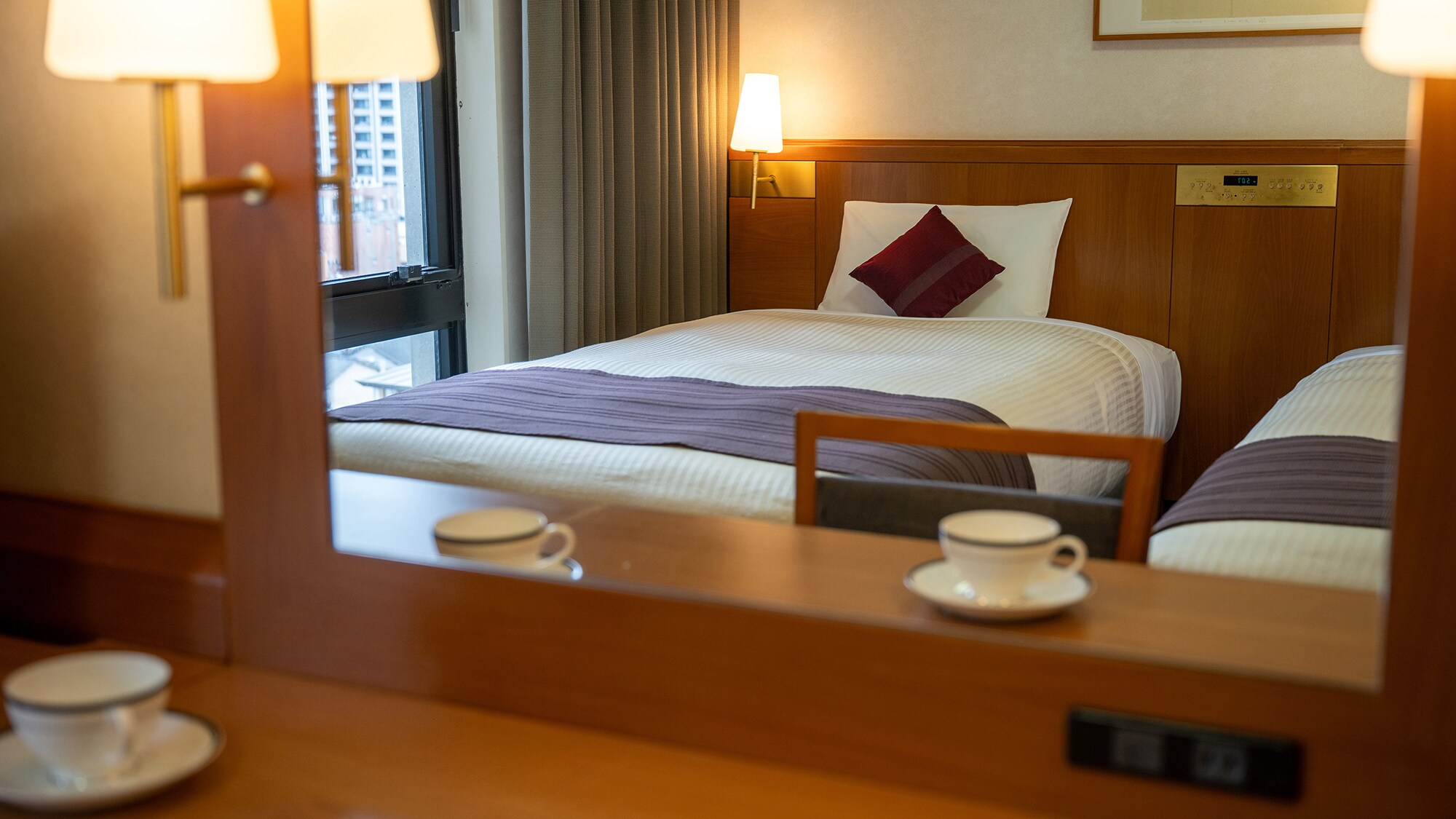 A warm, comforting light illuminates the room. Each room is equipped with a large mirror for easy grooming.